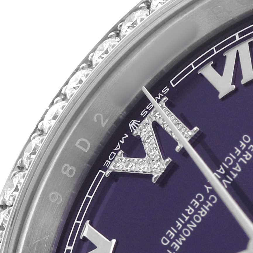 The image shows a close-up of the Rolex Datejust 126284RBR Men's Stainless Steel Purple Dial's dial with diamond-set Roman numerals and part of the diamond bezel.