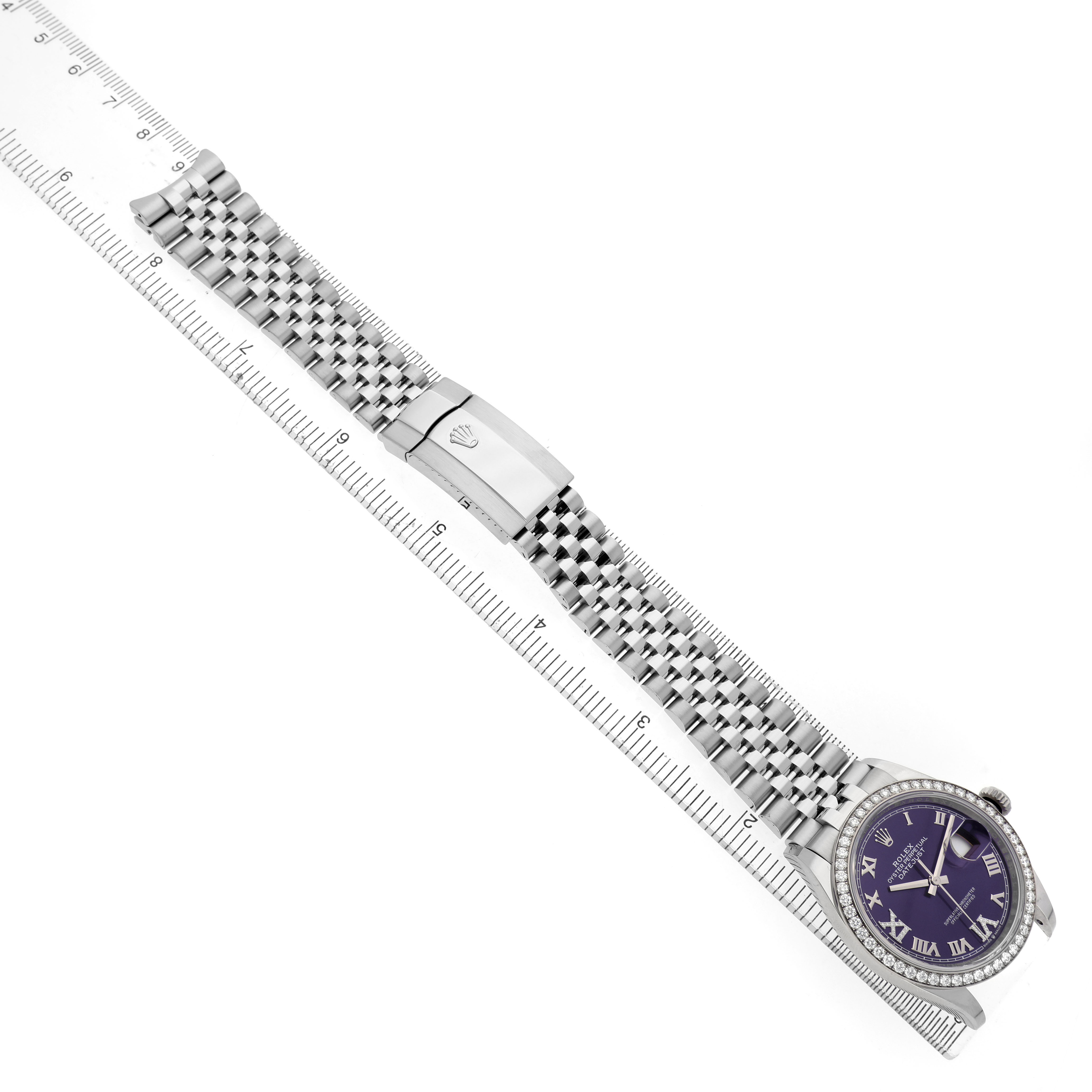 The Rolex Datejust 126284RBR Men's Stainless Steel Purple Dial watch is shown from a top view, highlighting the bracelet, clasp, and a partial view of the dial and case.