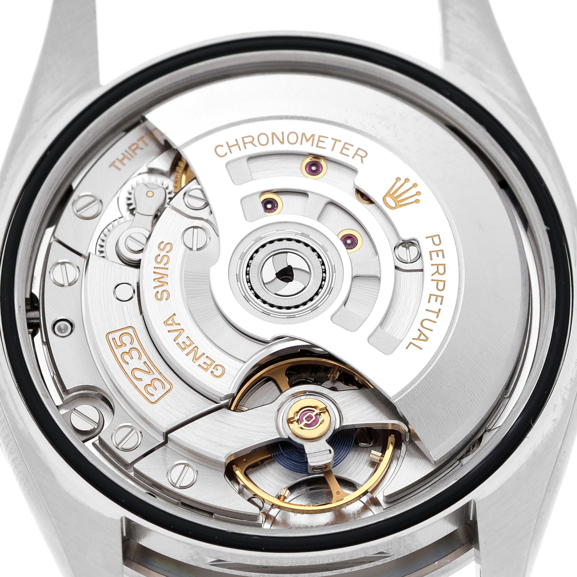 The image shows the movement of a Rolex Datejust 126284RBR Men's Stainless Steel Purple Dial watch, featuring the rotor, gears, and intricate internal mechanisms.