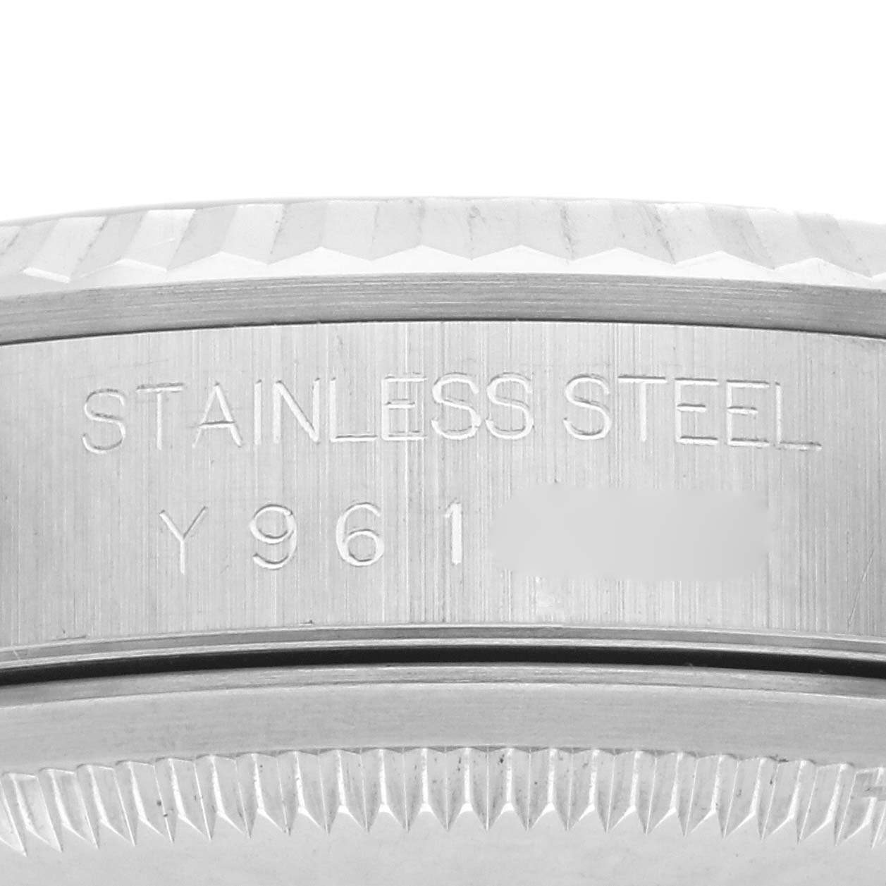 The image shows a close-up of the stainless steel side of a Rolex Datejust 16234 Men
s Steel and Gold (two tone) Silver Dial 16234 Men
s Steel and Gold (two tone) Silver Dial watch case, featuring engravings.
