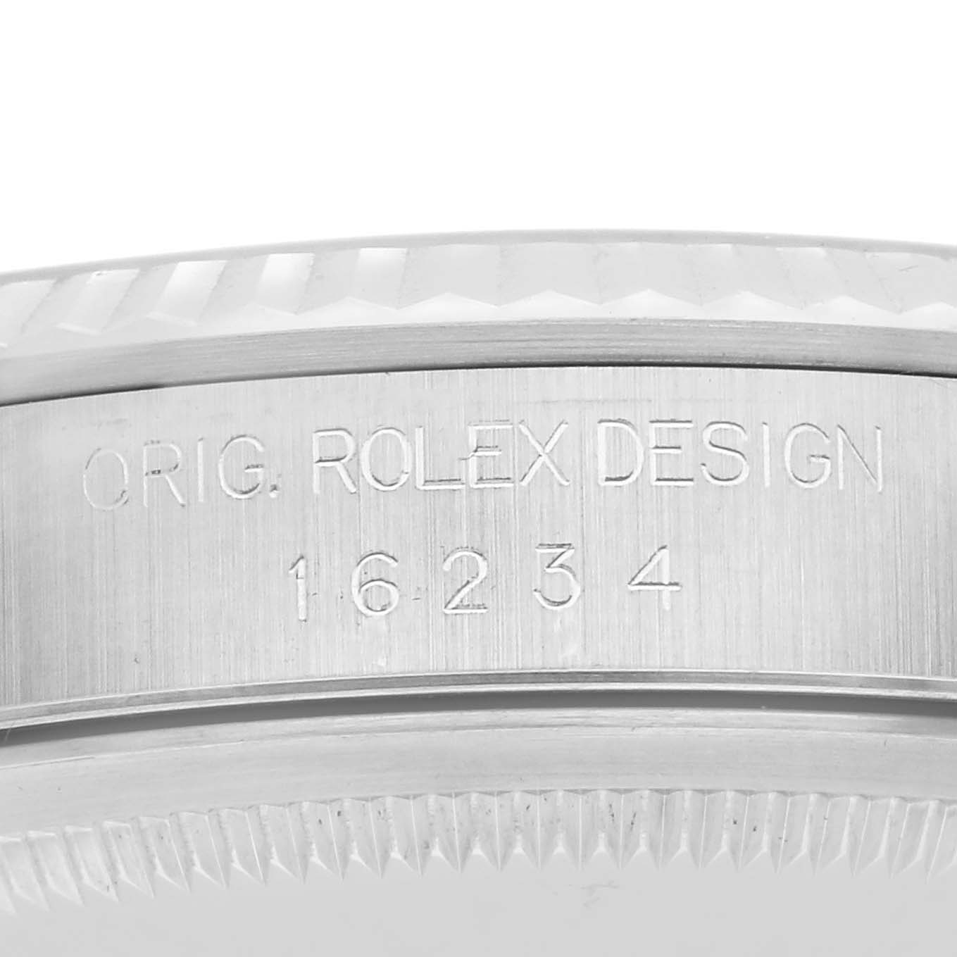 The image shows a close-up side view of a Rolex Datejust 16234 Men
s Steel and Gold (two tone) Silver Dial 16234 Men
s Steel and Gold (two tone) Silver Dial bezel, highlighting the model number and "ORIG. ROLEX DESIGN" engraving.