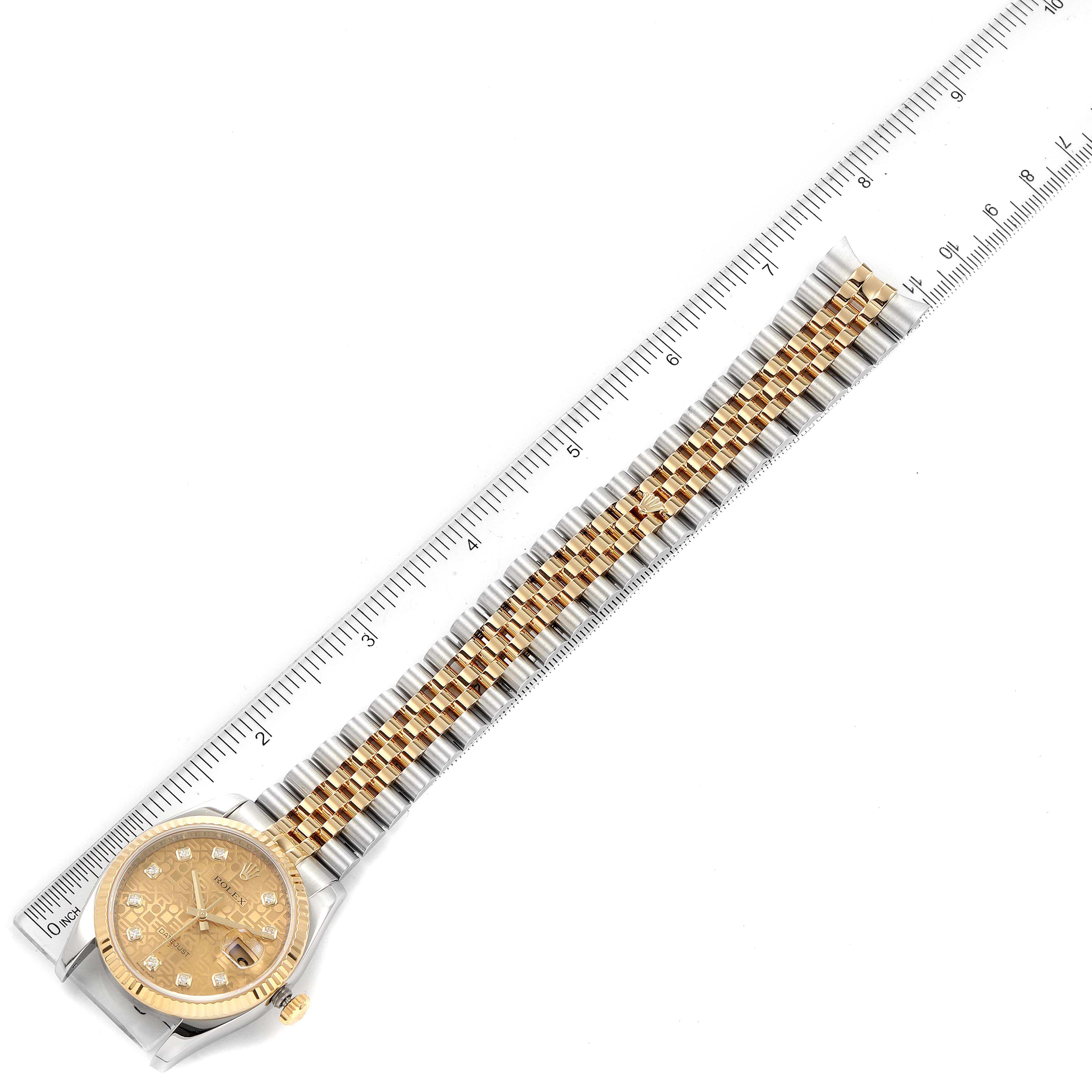This image shows a top view of a Rolex Datejust 116233 Men's Steel and Gold (two tone) Champagne Dial 116233 Men's Steel and Gold (two tone) Champagne Dial watch, including its gold and silver bracelet and dial.