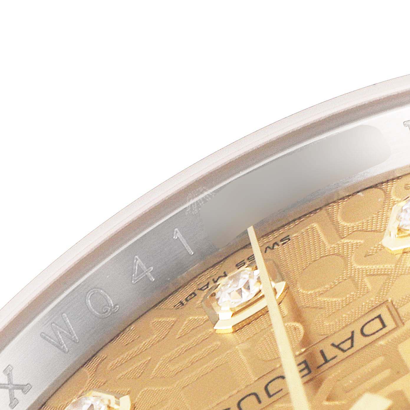 The image shows a close-up of the Rolex Datejust 116233 Men's Steel and Gold (two tone) Champagne Dial 116233 Men's Steel and Gold (two tone) Champagne Dial watch's dial and rehaut inscription from an angled view.