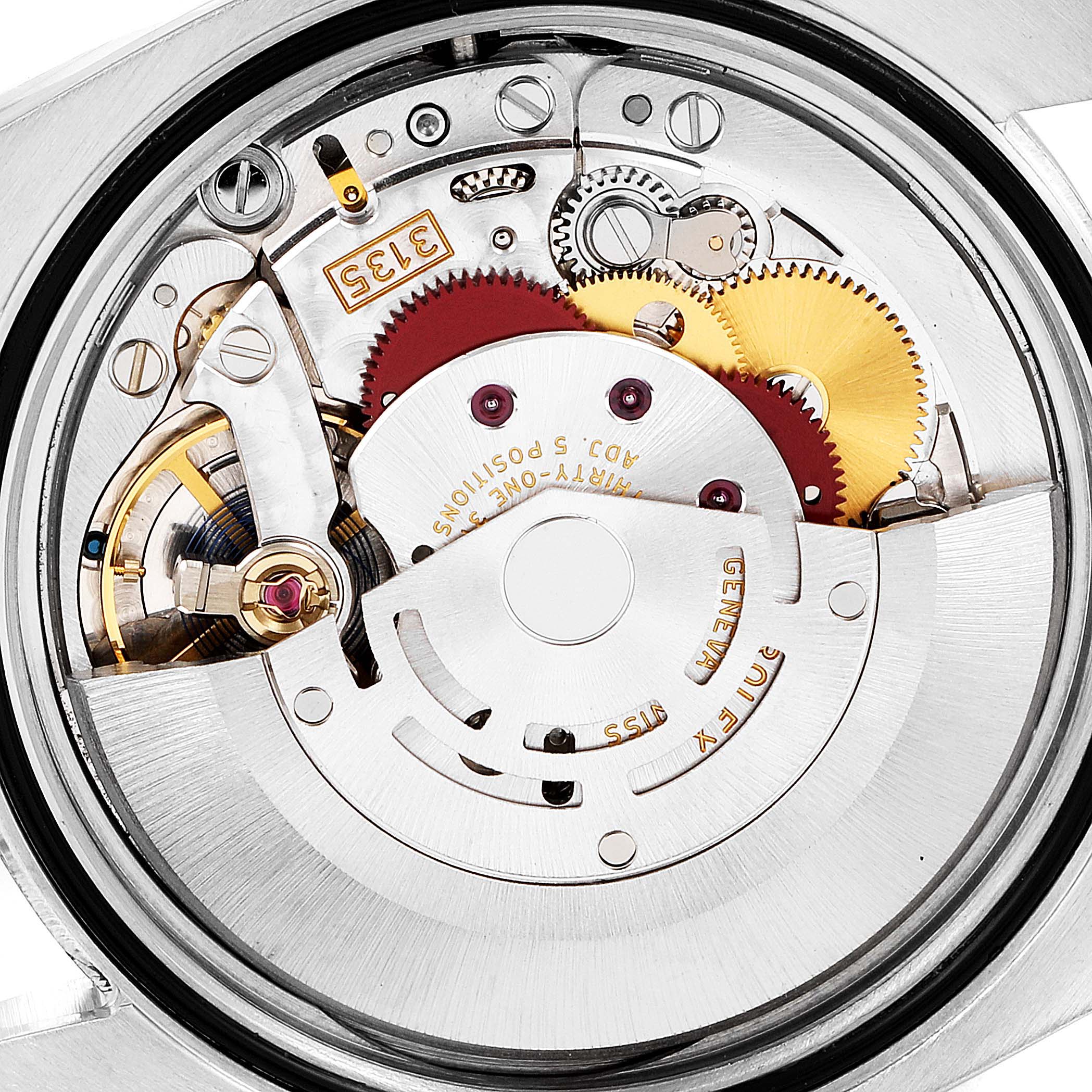This close-up image shows the intricate inner mechanism of a Rolex Datejust 116233 Men's Steel and Gold (two tone) Champagne Dial 116233 Men's Steel and Gold (two tone) Champagne Dial watch, highlighting gears and the movement components.