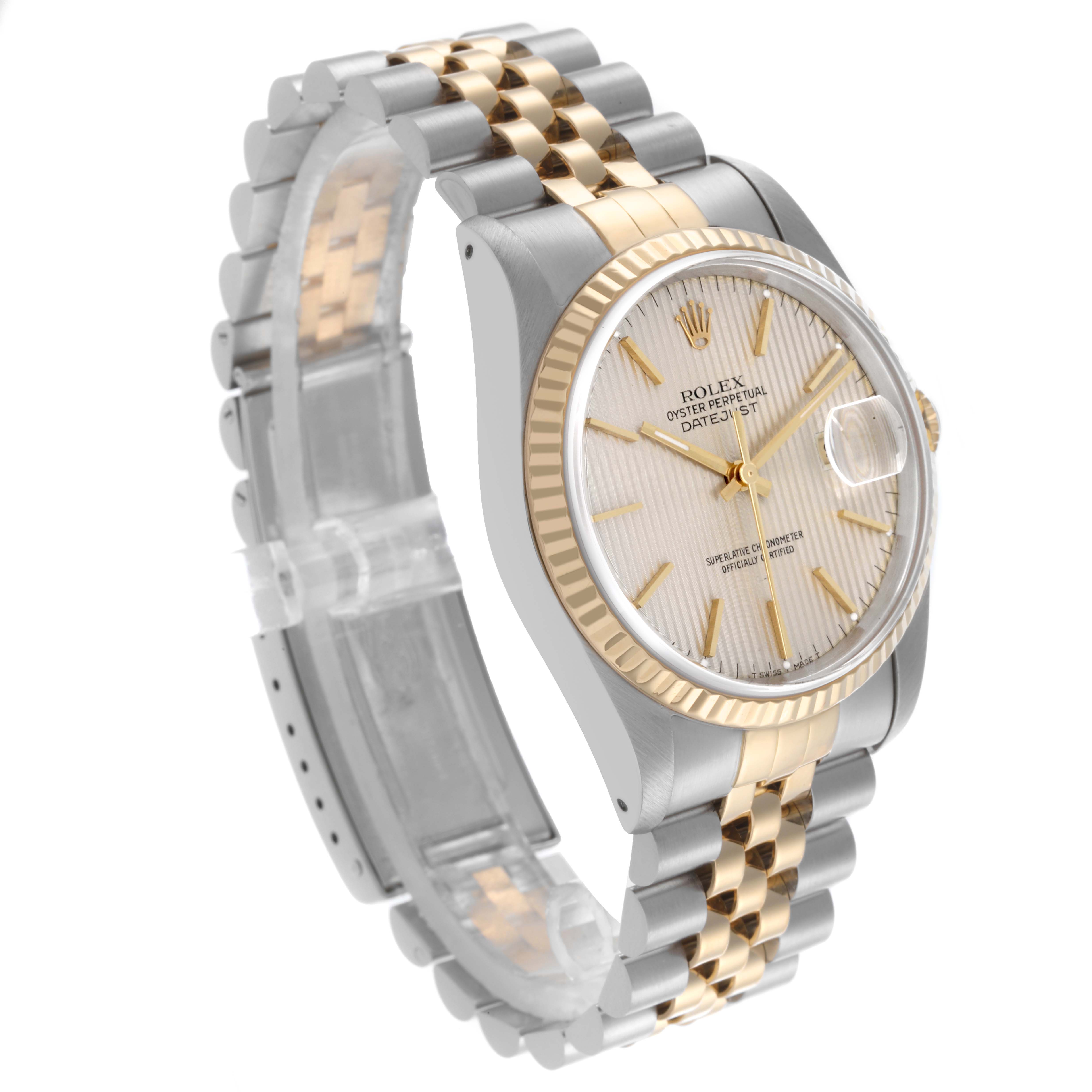 The Rolex Datejust 16233 Men
s Steel and Gold (two tone) Silver Dial 16233 Men
s Steel and Gold (two tone) Silver Dial watch is shown at a slight angle, highlighting the face, bezel, and two-tone bracelet.