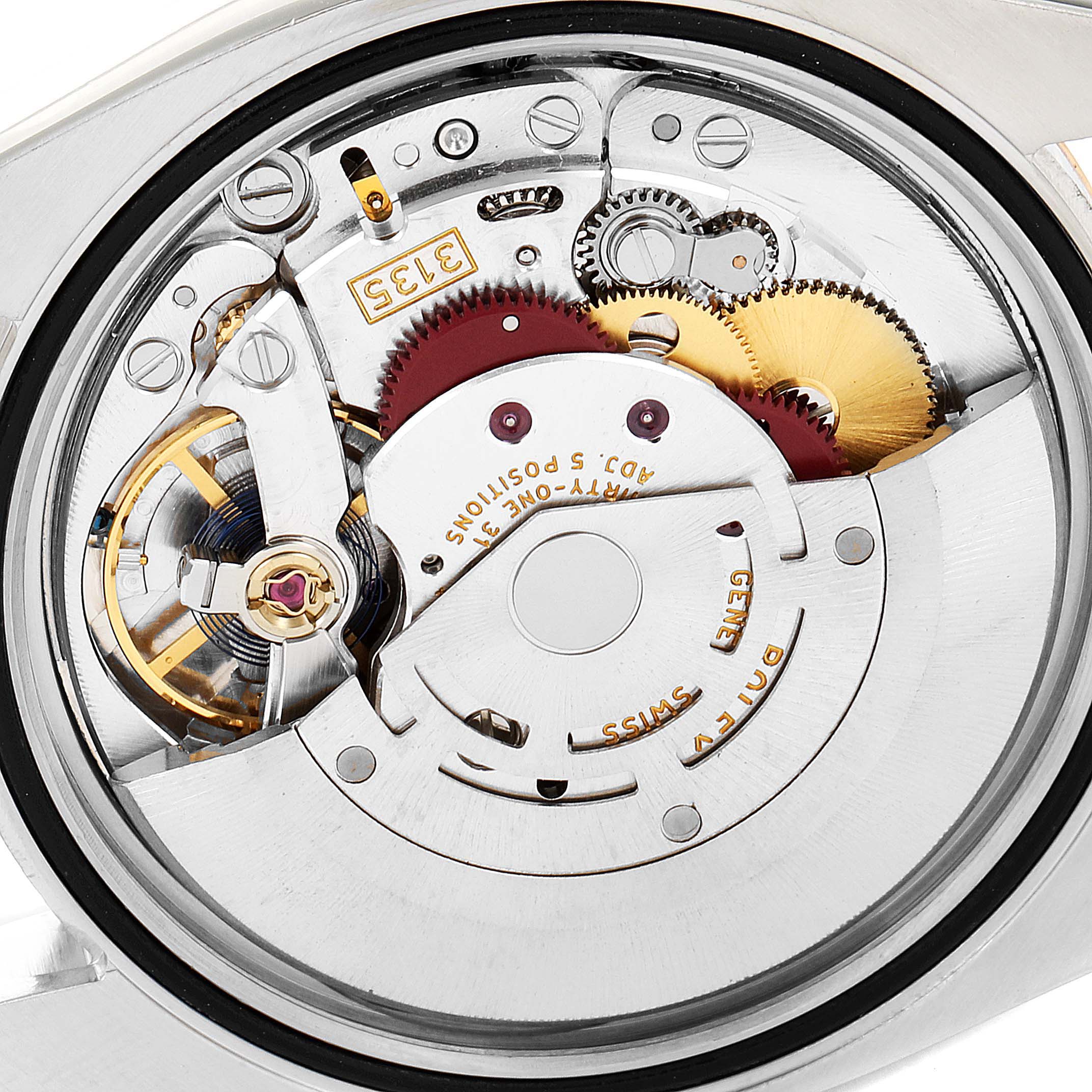 This is a macro shot of the Rolex Datejust 116231 Men's Steel and Gold (two tone) Pink Dial 116231 Men's Steel and Gold (two tone) Pink Dial's internal mechanism, showing gears and intricate components.