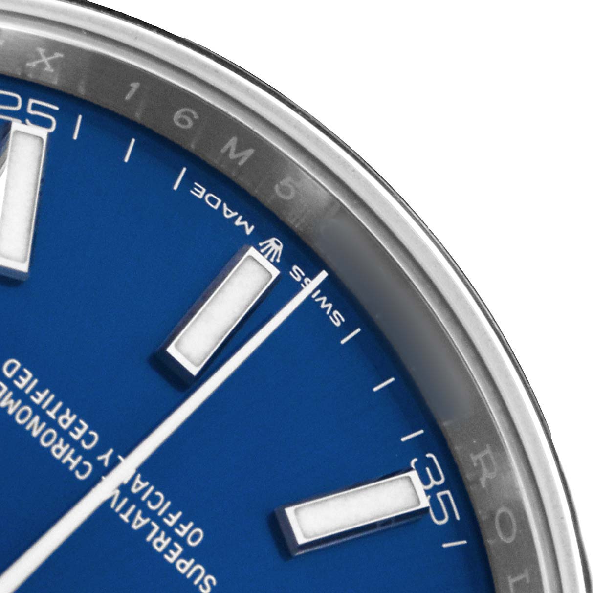The image shows a close-up of the dial and bezel of a Rolex Datejust 41 126300 Men
s Stainless Steel Blue Dial with a blue face and visible markers.