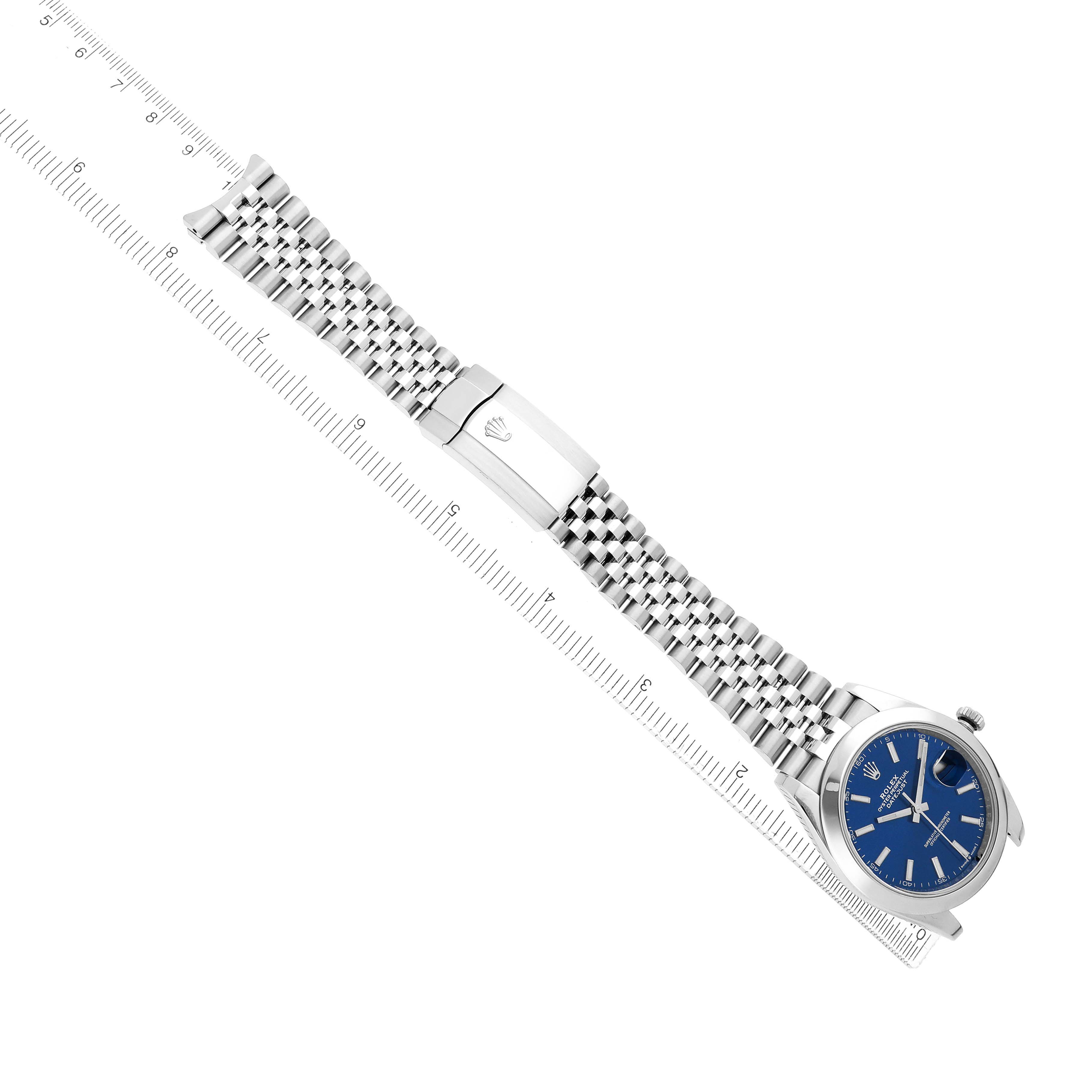 The Rolex Datejust 41 126300 Men
s Stainless Steel Blue Dial watch is shown laid flat, highlighting the blue dial, case, and full metal bracelet with a clasp.
