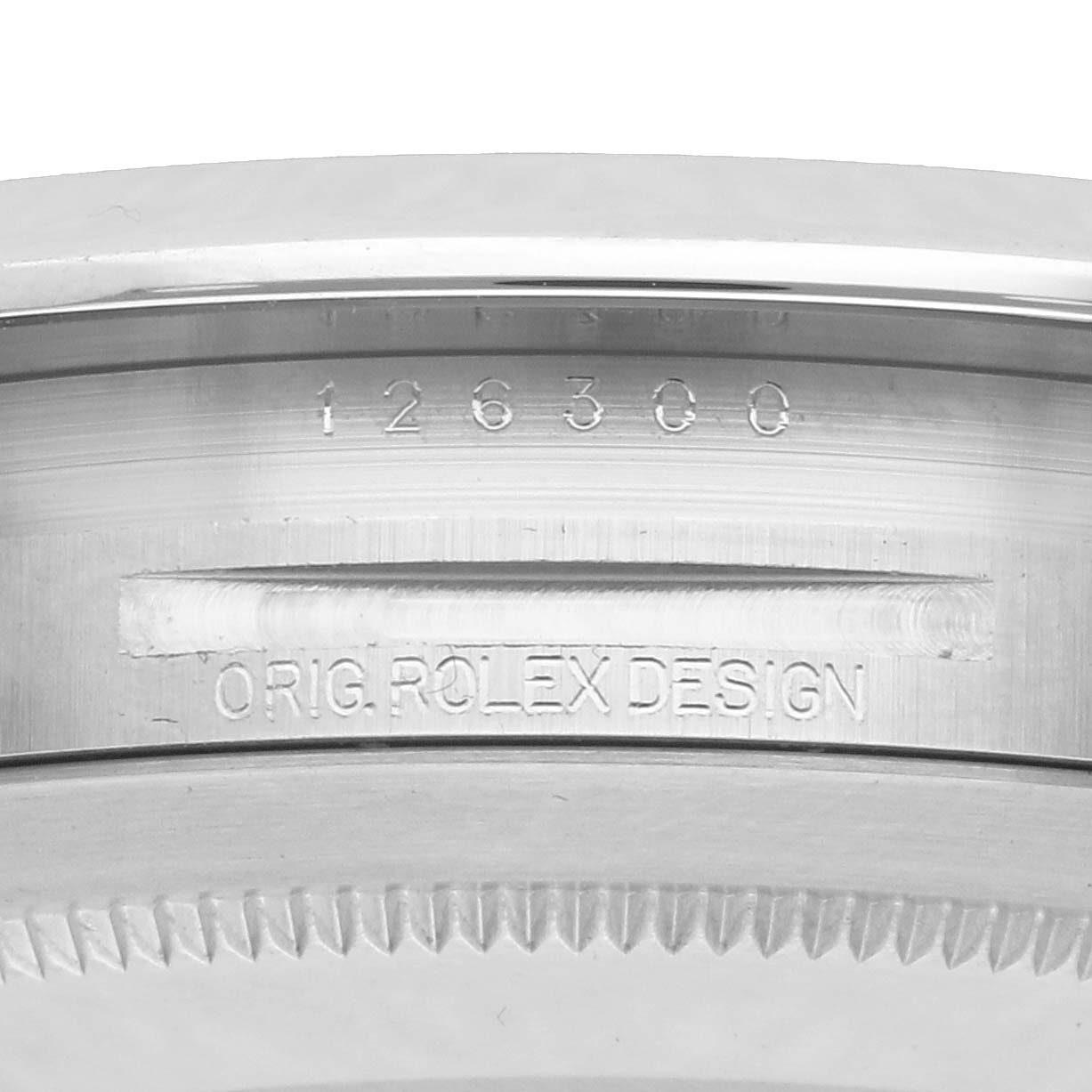 This image shows the side profile of a Rolex Datejust 41 126300 Men
s Stainless Steel Blue Dial, focusing on the engraved bezel and model details.