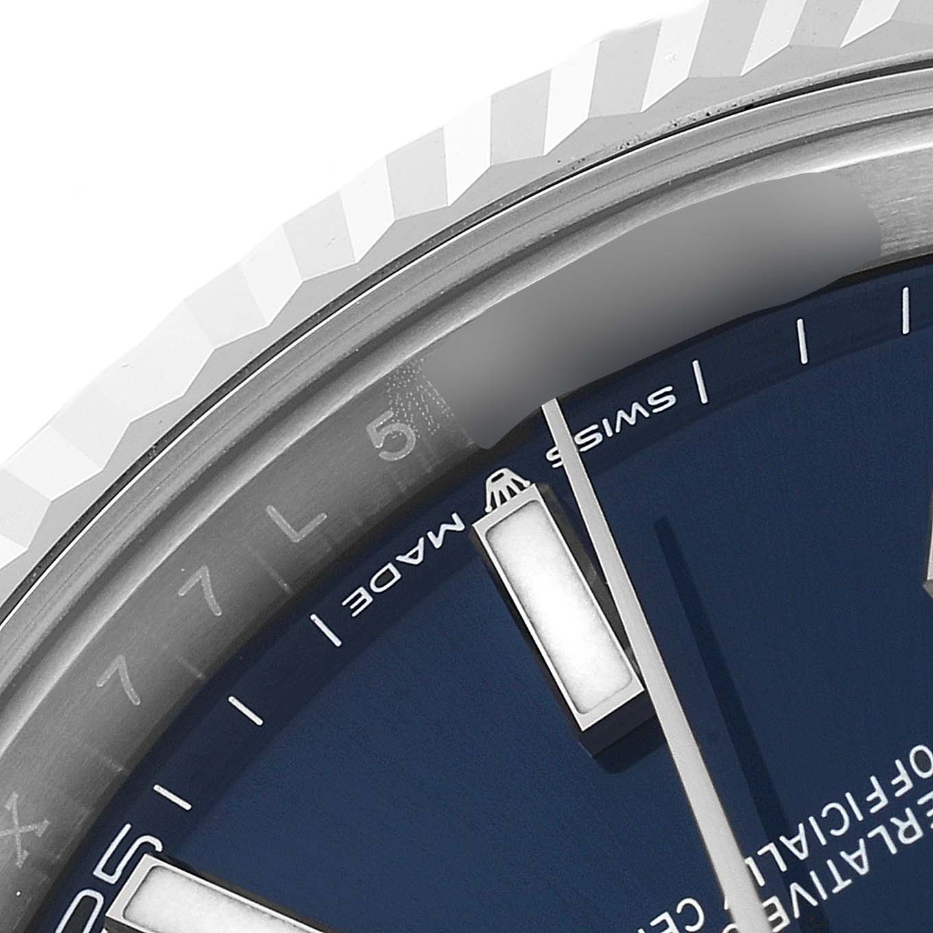 This image shows a close-up of the bezel, part of the dial, and an hour marker of the Rolex Datejust 41 126334 Men's Stainless Steel Blue Dial 126334 Men's Stainless Steel Blue Dial watch.