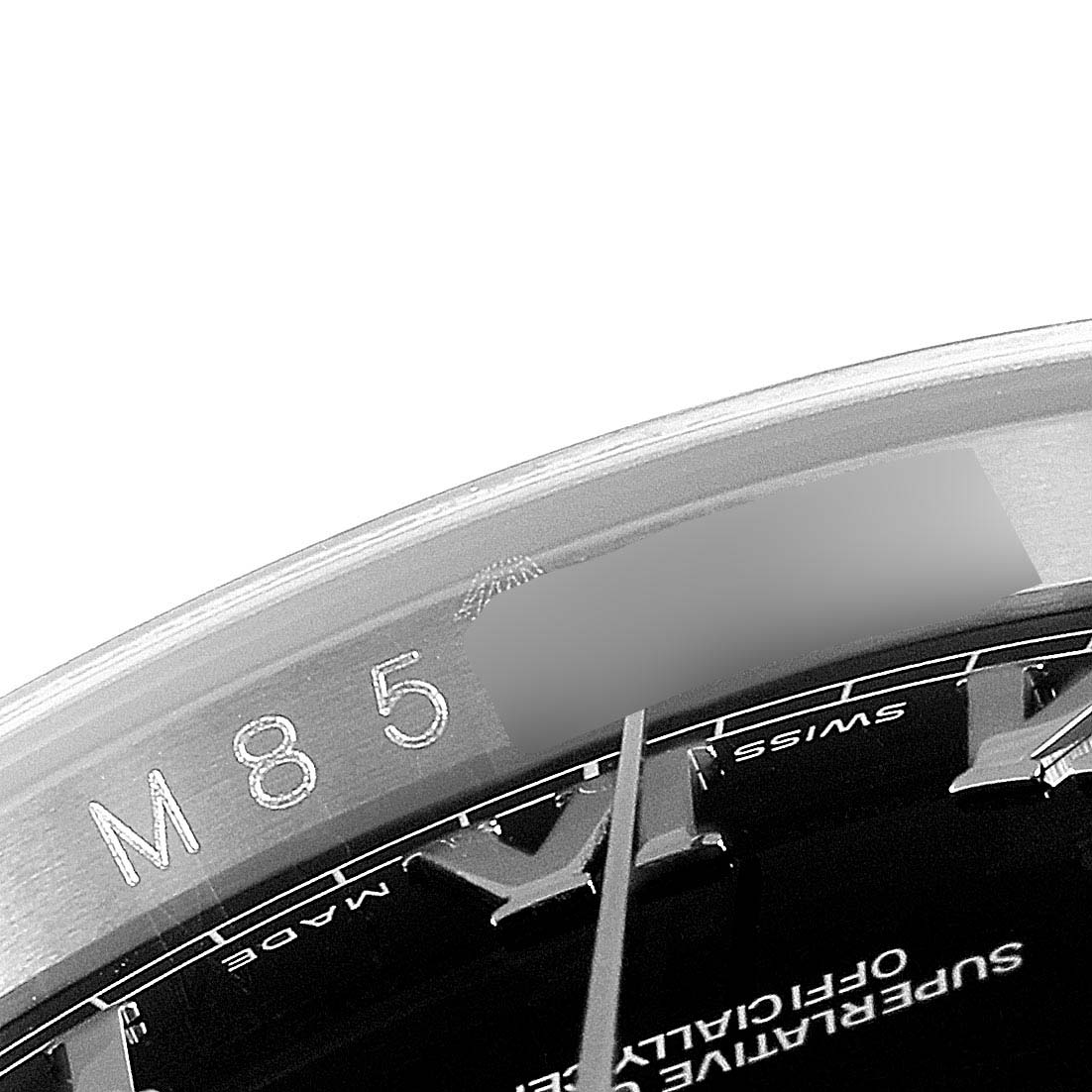 This image shows a close-up angle of the Rolex Datejust 116200 Men's Stainless Steel Black Dial 116200 Men's Stainless Steel Black Dial watch, highlighting part of the dial and inner bezel.