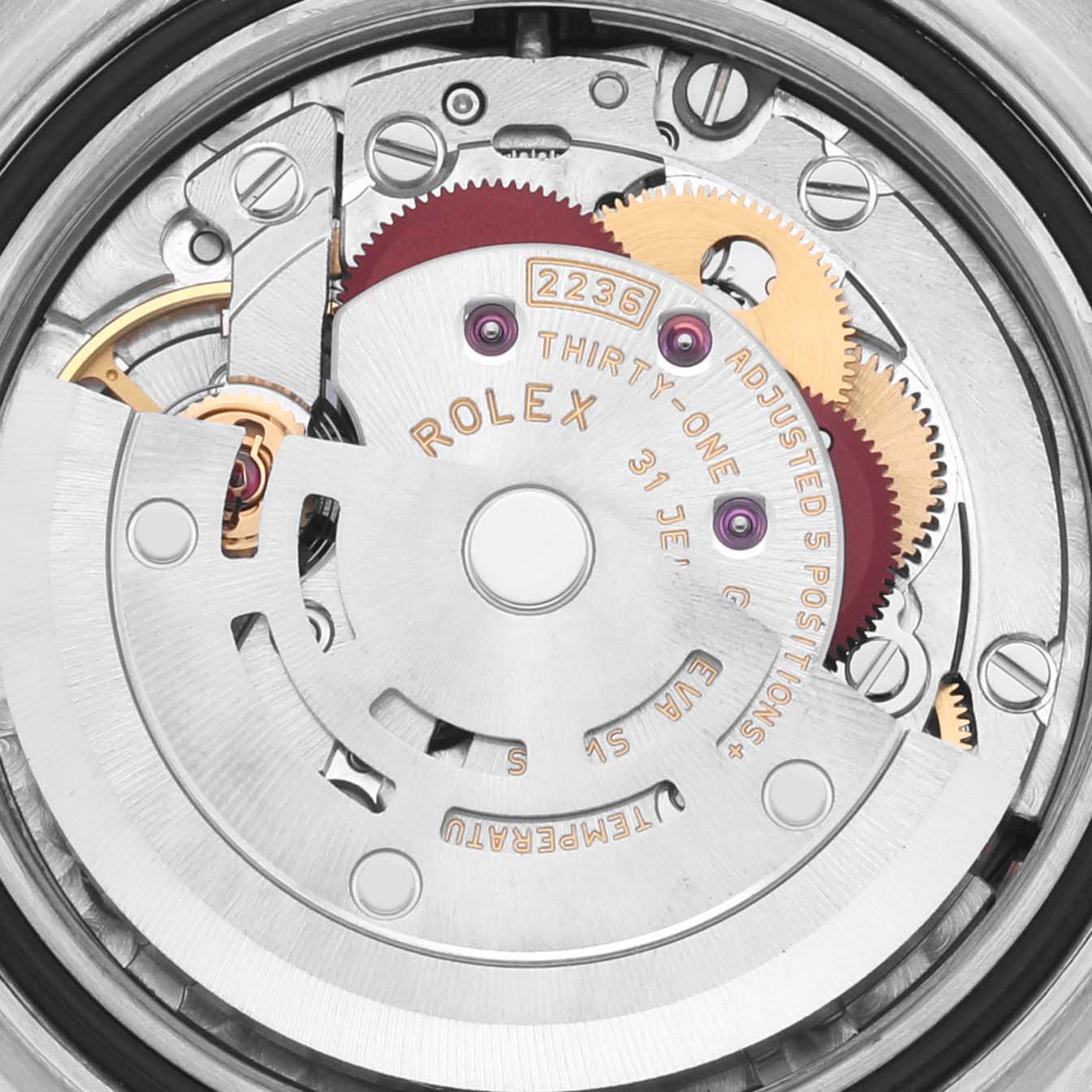 The image shows a close-up of the Rolex Datejust 279171 Women's Steel and Gold (two tone) Brown Dial 279171 Women's Steel and Gold (two tone) Brown Dial's movement, highlighting gears and mechanical parts.