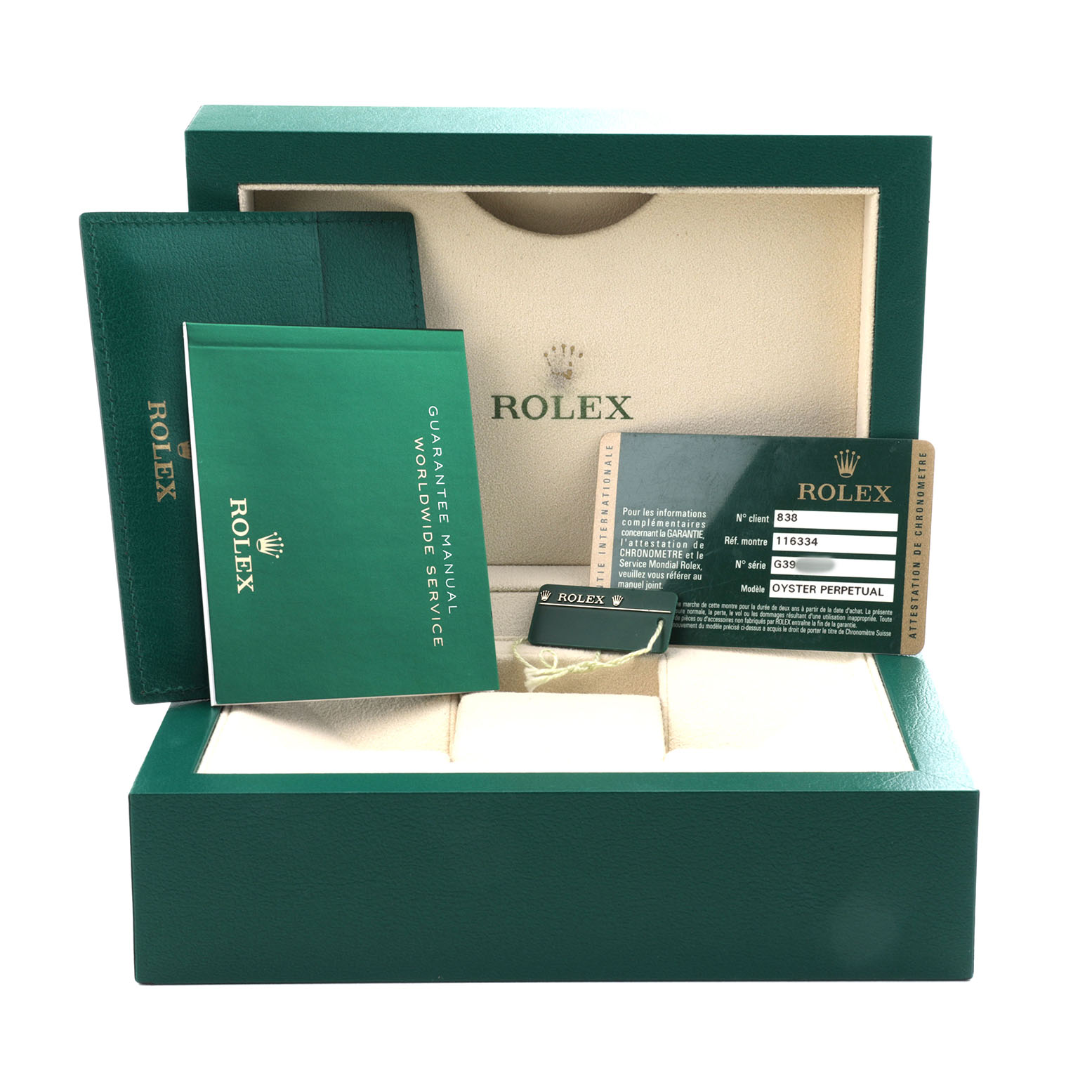 The image shows the packaging and accessories of a Rolex Datejust 41 116334 Men's Stainless Steel White Dial, including the box, manual, and warranty card.