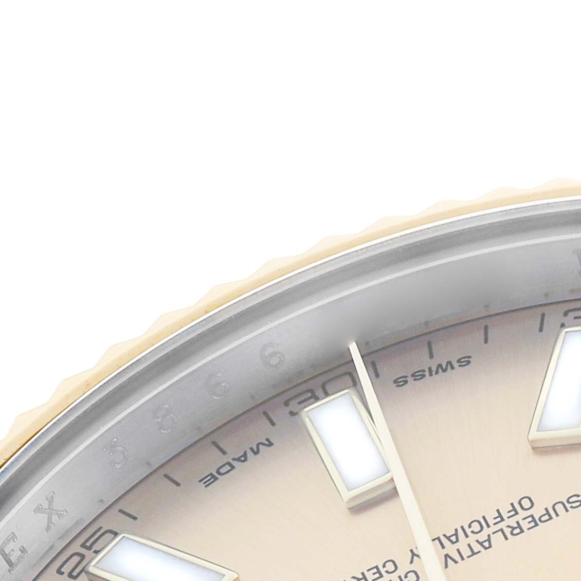 The image shows a partial close-up of the Rolex Datejust 41 116333 Men
s Steel and Gold (two tone) Champagne Dial dial, including the bezel, index markers, and part of the hands.
