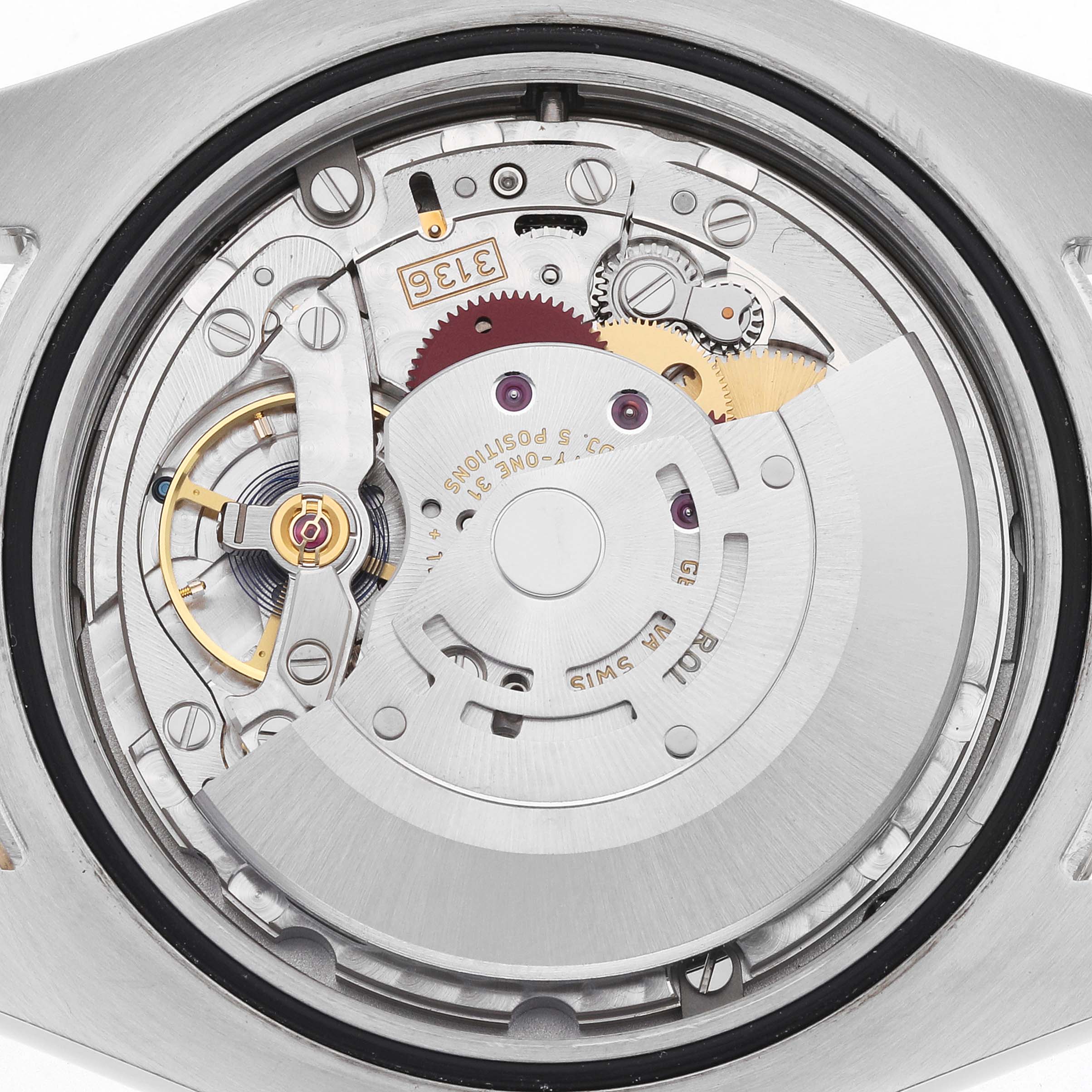 The image shows a close-up of the movement of a Rolex Datejust 41 116333 Men
s Steel and Gold (two tone) Champagne Dial, highlighting gears and the balance wheel.