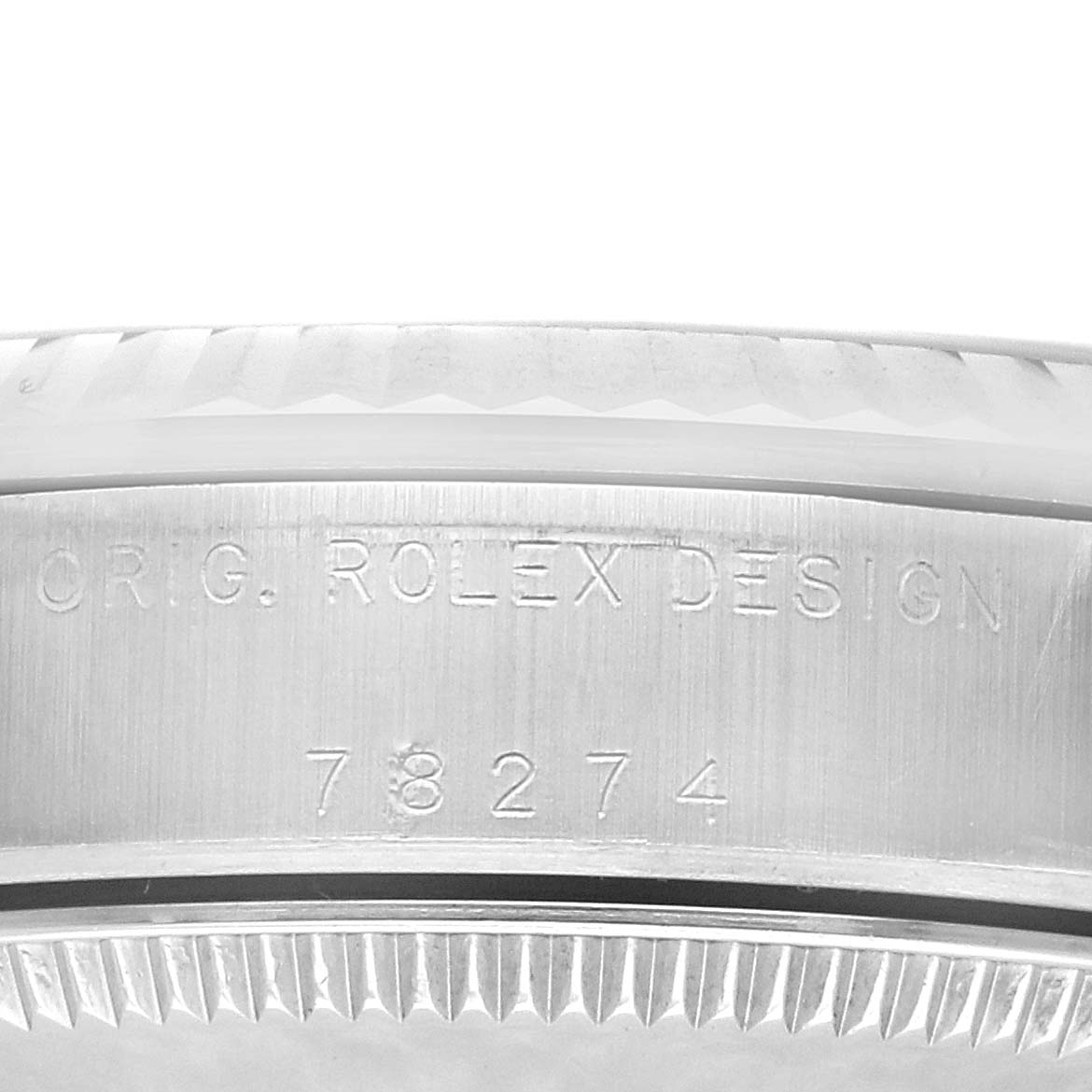 The image shows a close-up of the side of a Rolex Mid-Size 78274 Women's Stainless Steel Mother of Pearl Dial watch case with engraved markings.