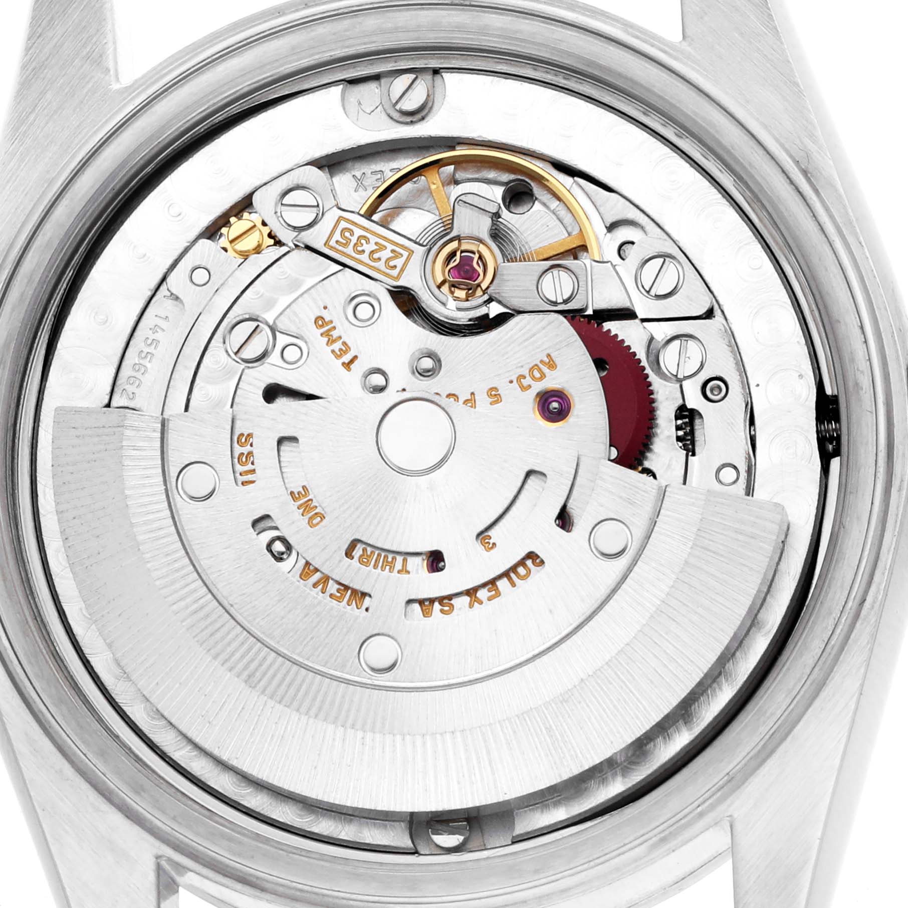 The image shows the movement of a mid-size Rolex watch, highlighting its intricate internal mechanisms from the back.