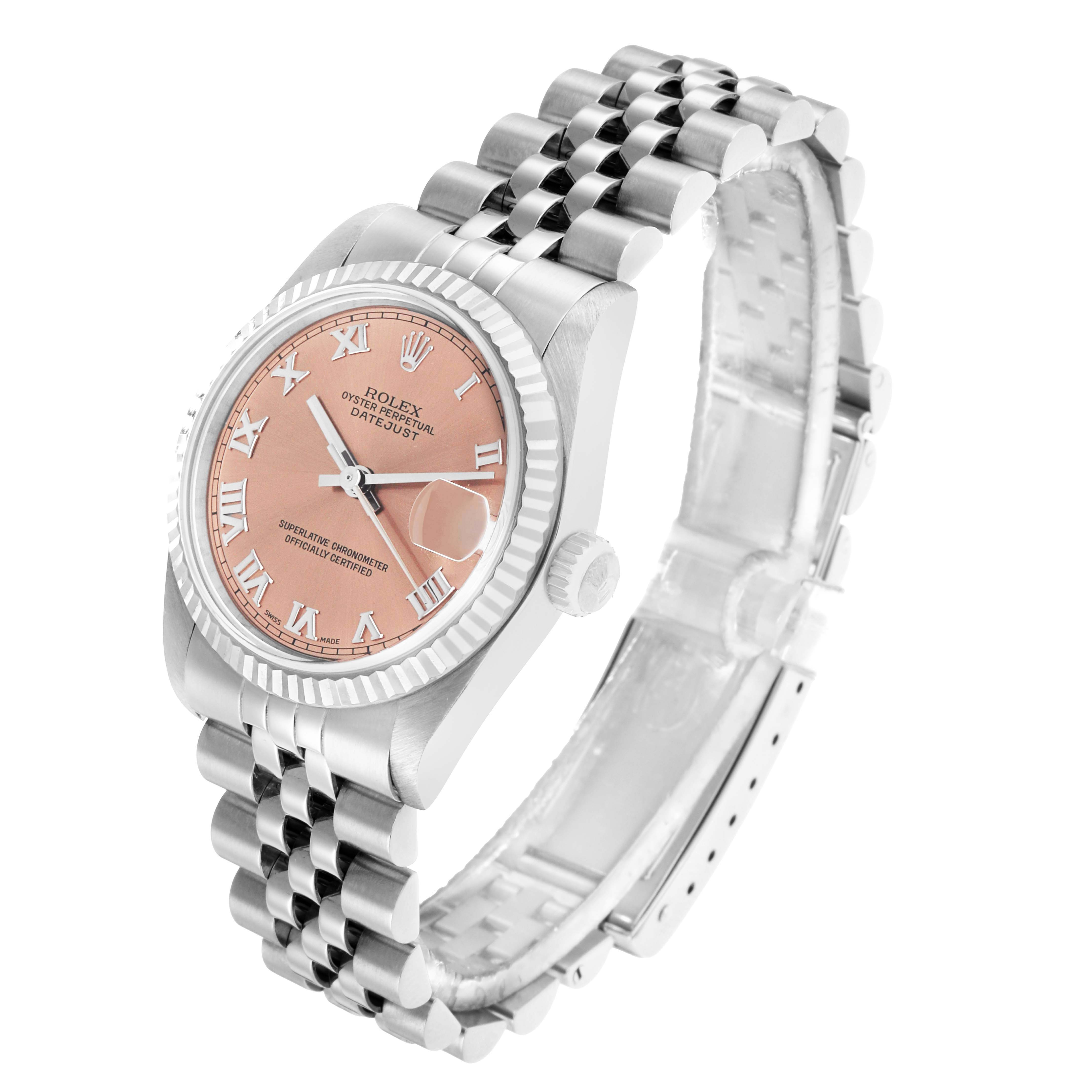 The Rolex Mid-Size 68274 Women's Stainless Steel Pink Dial watch is shown at a three-quarter angle, displaying the dial, bezel, crown, and Jubilee bracelet.