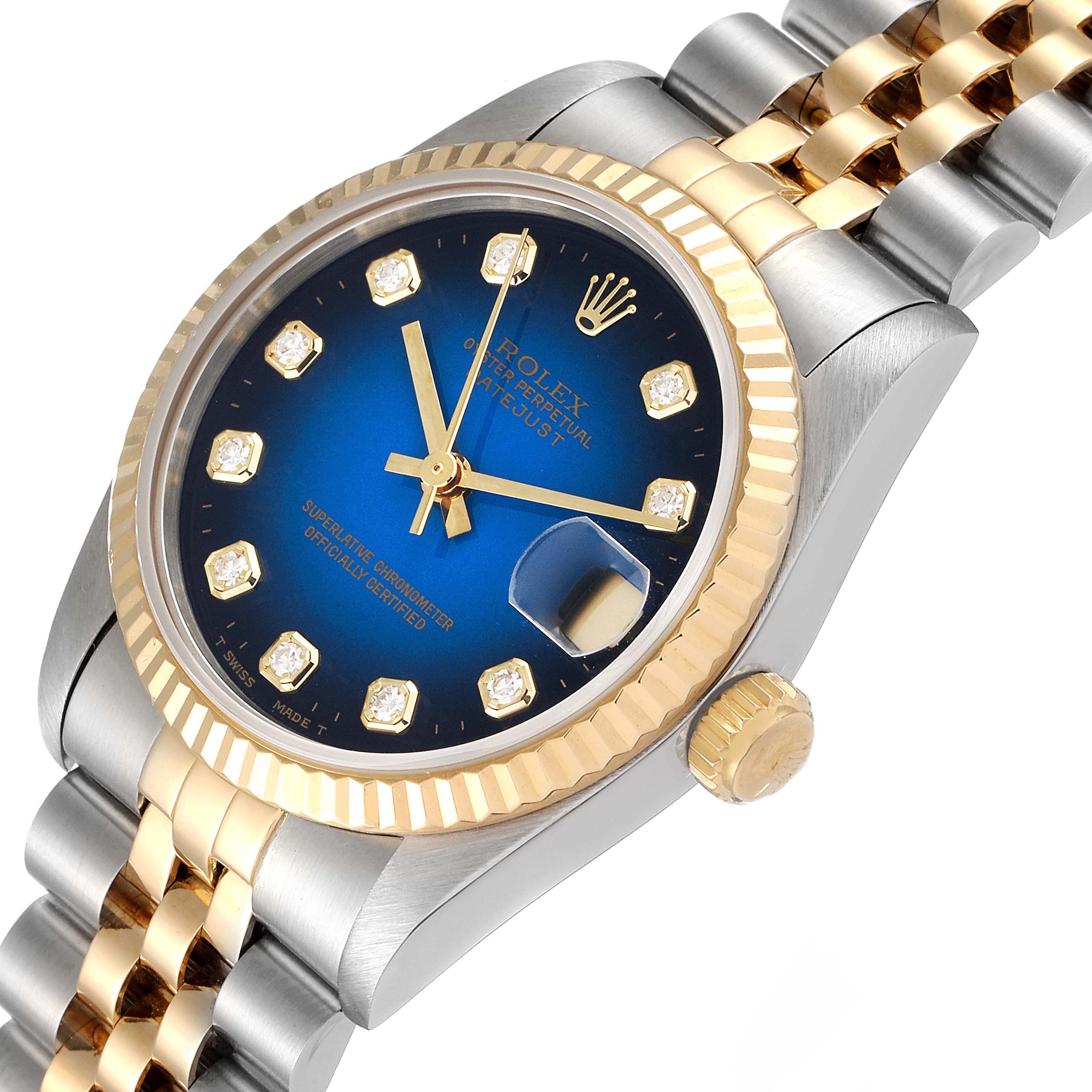 This image shows a Rolex Mid-Size 68273 Women's Steel and Gold (two tone) Blue Dial 68273 Women's Steel and Gold (two tone) Blue Dial watch at a slight angle, highlighting the dial, bezel, crown, and bracelet.