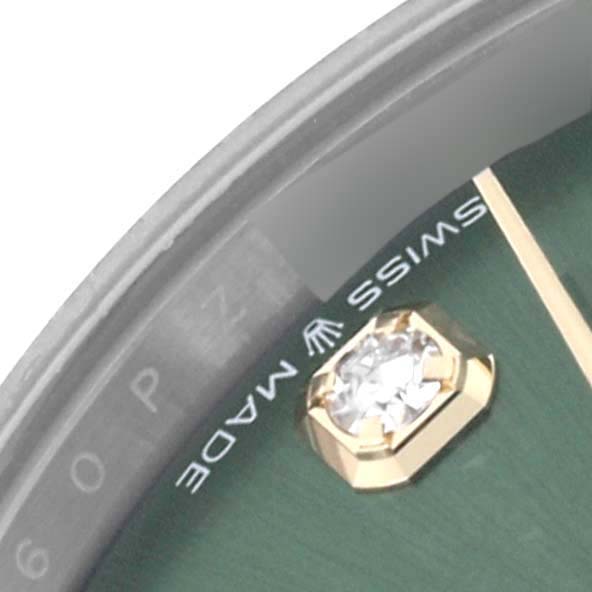 The image shows a close-up of a Rolex Mid-Size 278343RBR-0030 Women's Steel and Gold (two tone) Green Dial 278343RBR-0030 Women's Steel and Gold (two tone) Green Dial watch, highlighting a diamond hour marker and "SWISS MADE" text.