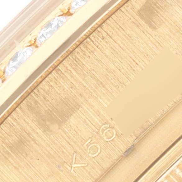 The image shows a close-up of the bracelet detail on a Rolex President 179138 Women's Yellow Gold Champagne Dial 179138 Women's Yellow Gold Champagne Dial watch, highlighting its gold links and diamond accents.