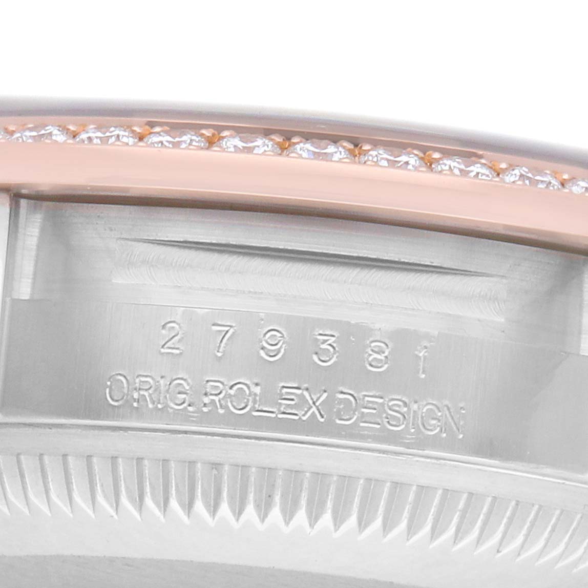 The image shows the side view of a Rolex Datejust 279381 Women's Steel and Gold (two tone) Green Dial, focusing on the case wall with engraved model details and a diamond-set bezel.