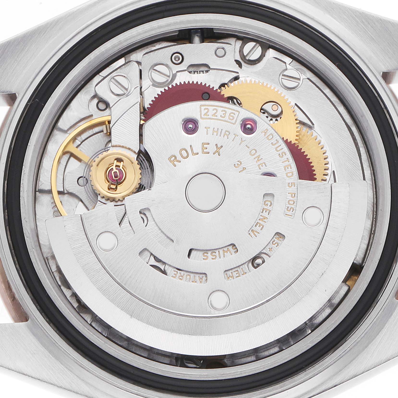 The image shows the movement of a Rolex Datejust 279381 Women's Steel and Gold (two tone) Green Dial watch, focusing on its intricate gears and rotor from a top-down perspective.