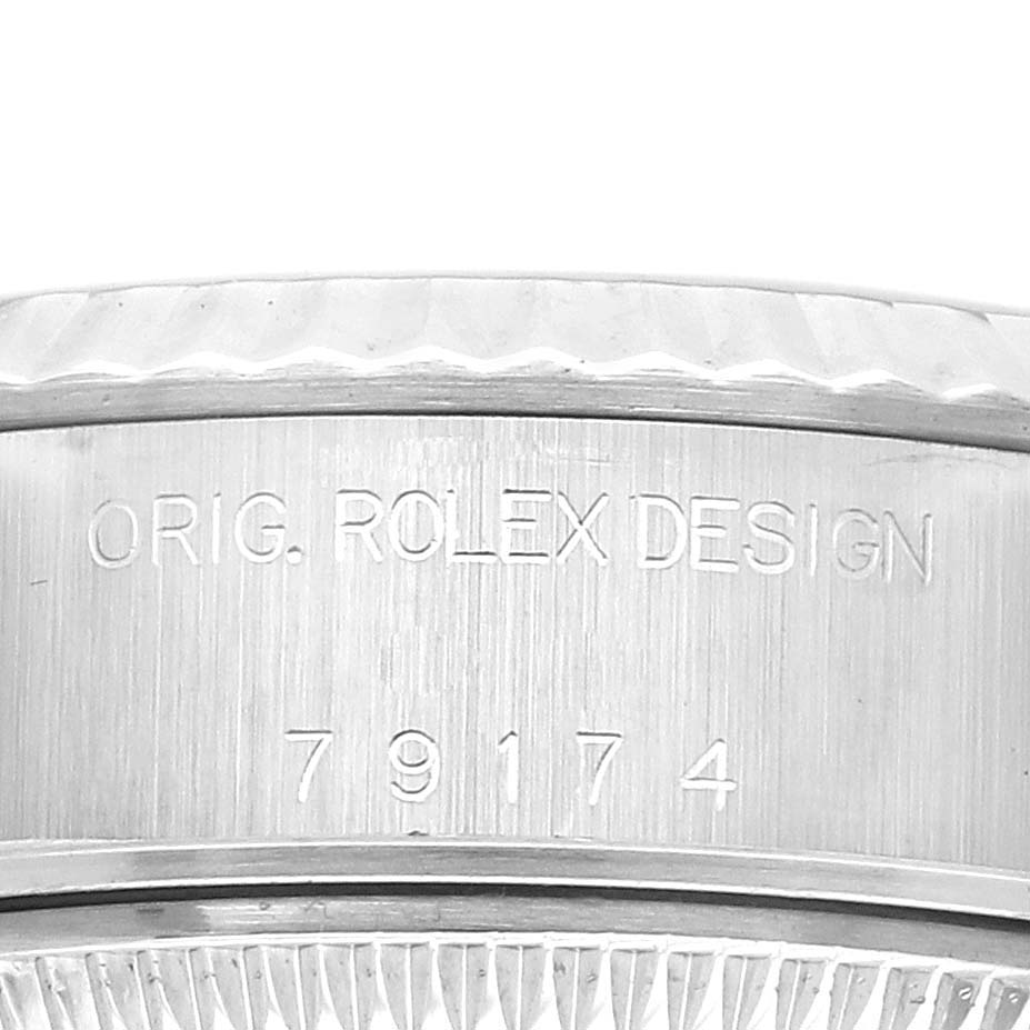 The image shows a close-up of the side of a Rolex Datejust 79174 Women's Stainless Steel Silver Dial, highlighting engraving details.