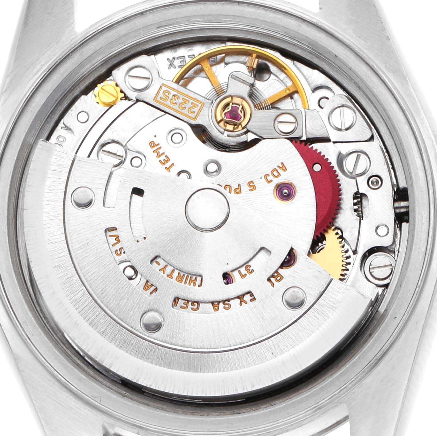 The image shows an overhead view of the Rolex Datejust 79174 Women's Stainless Steel Silver Dial's movement, highlighting gears, the rotor, and internal components.