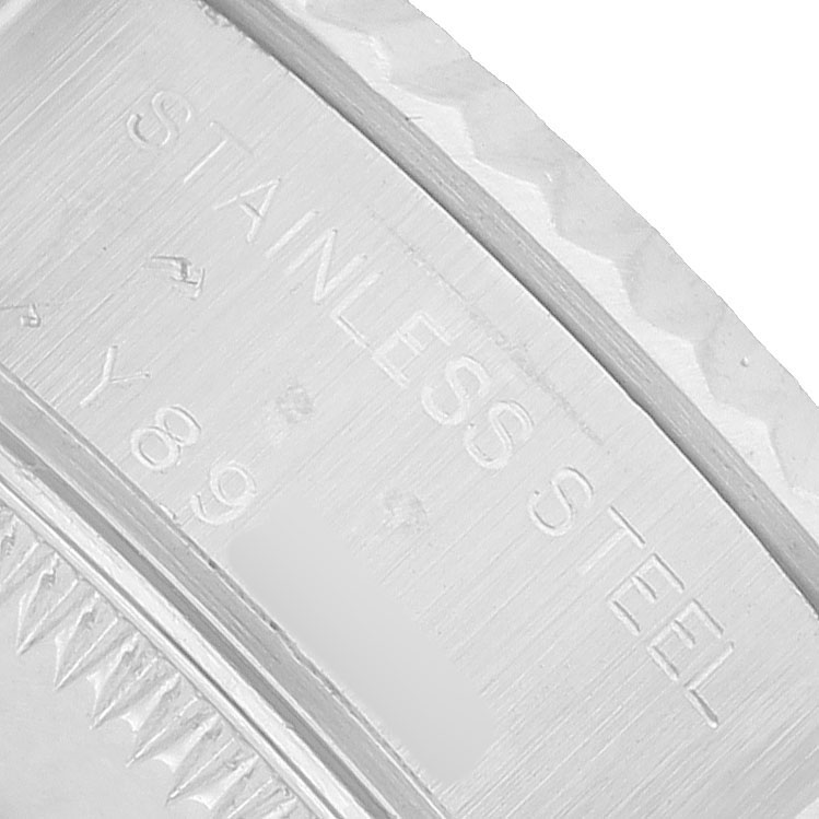 The image shows a close-up of the inner bezel or rehaut of a Rolex Datejust 79174 Women's Stainless Steel Mother of Pearl Dial, displaying the "Stainless Steel" engraving.