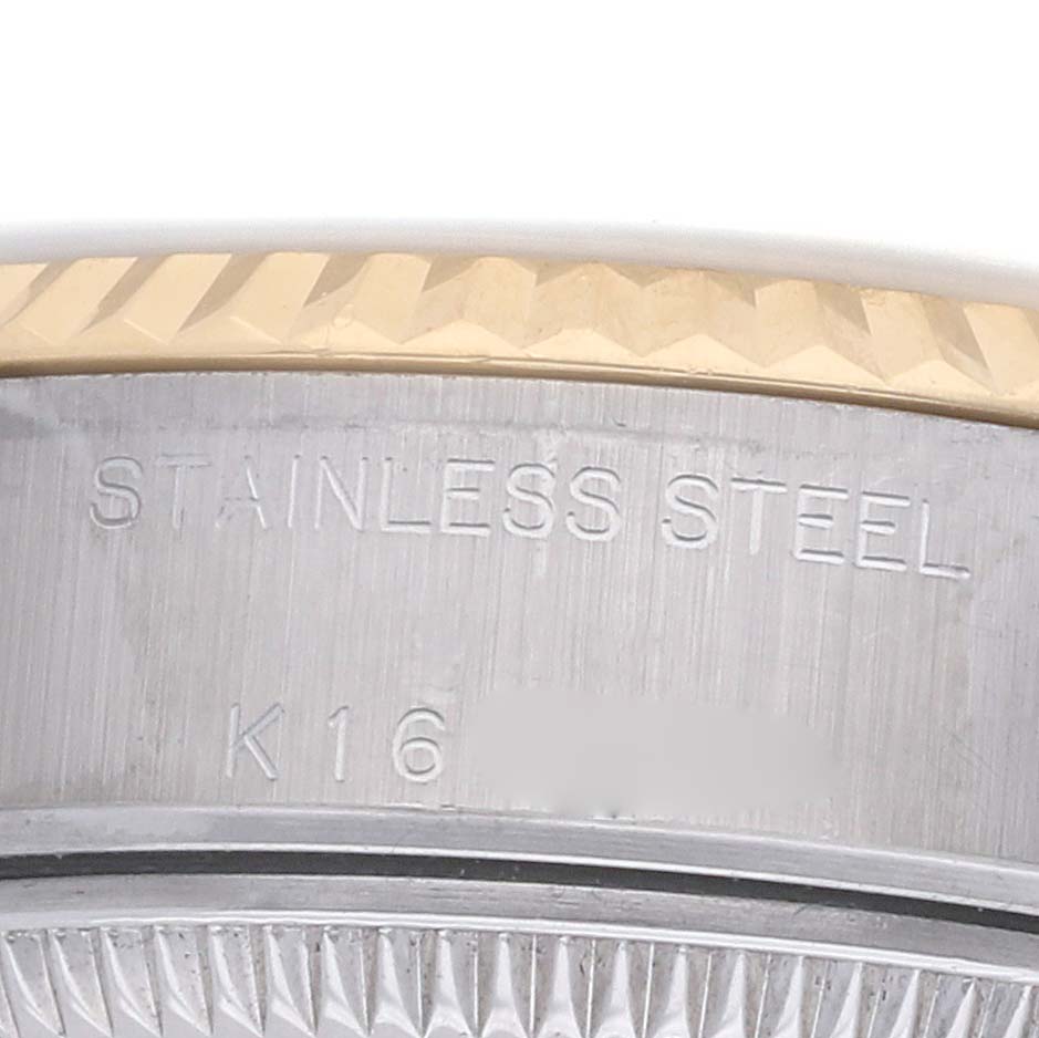 The image shows a close-up side view of a Rolex Datejust 79173 Women's Steel and Gold (two tone) Champagne Dial, highlighting the stainless steel and gold fluted bezel.