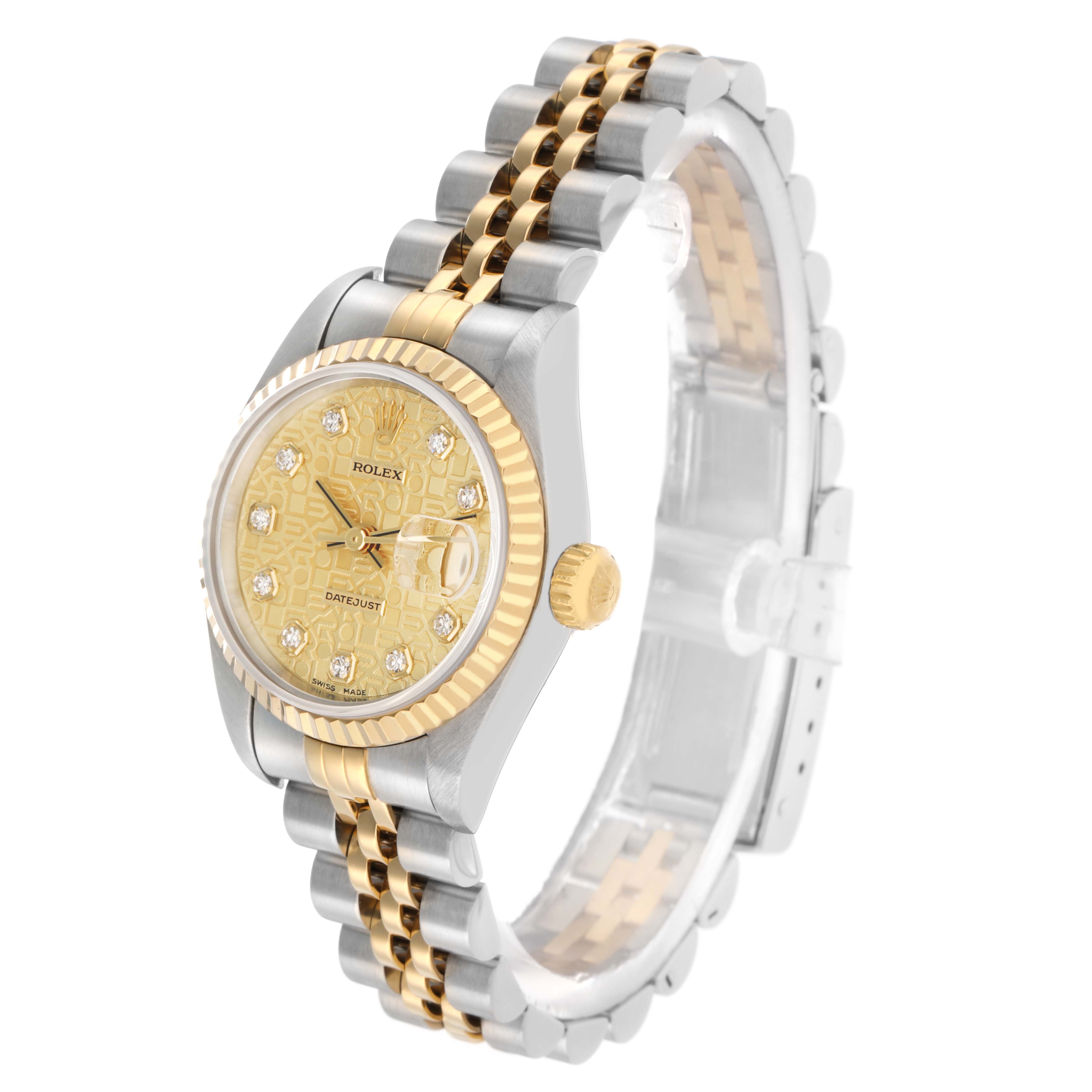 The Rolex Datejust 69173 Women
s Steel and Gold (two tone) Champagne Dial watch is shown at a three-quarter angle displaying its face, fluted bezel, and two-tone bracelet.