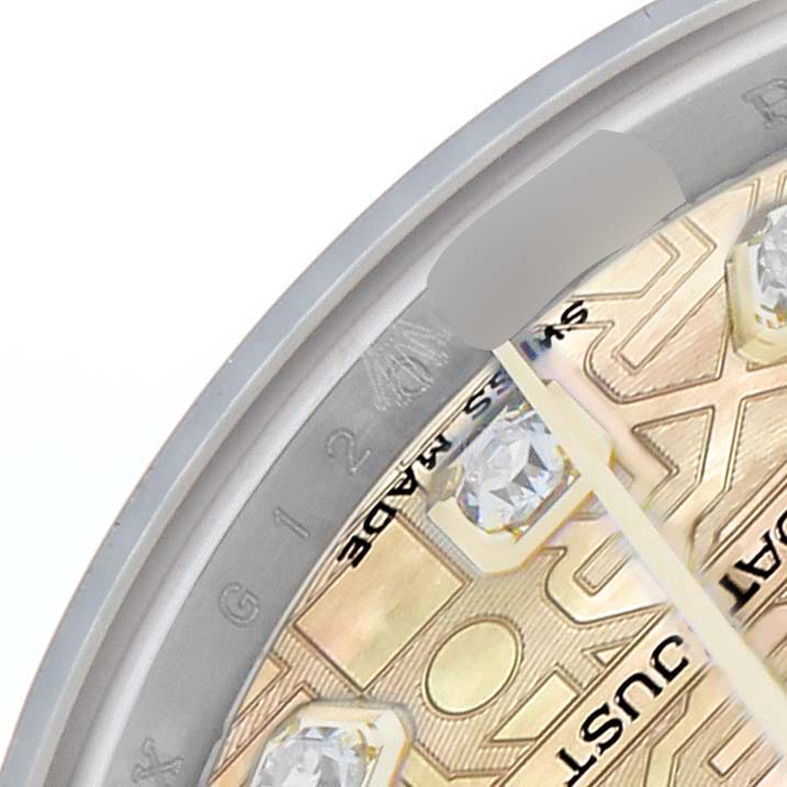 The image shows a close-up of the dial and gemstones of a Rolex Datejust 179173 Women's Steel and Gold (two tone) Mother of Pearl Dial, highlighting part of the bezel and inner markings.