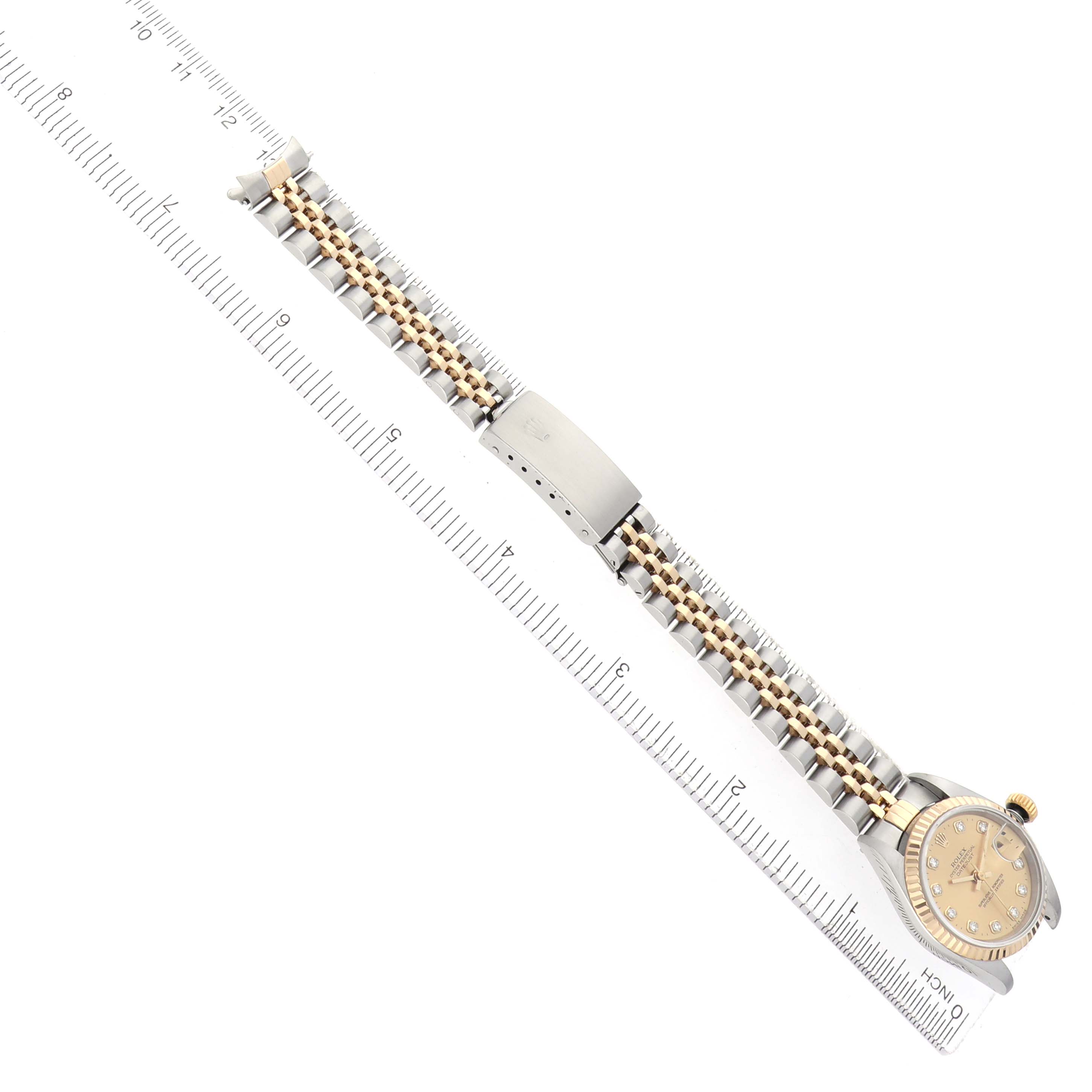The Rolex Datejust 69173 Women's Steel and Gold (two tone) Champagne Dial watch is shown from above, featuring the full bracelet and dial with a two-tone design.