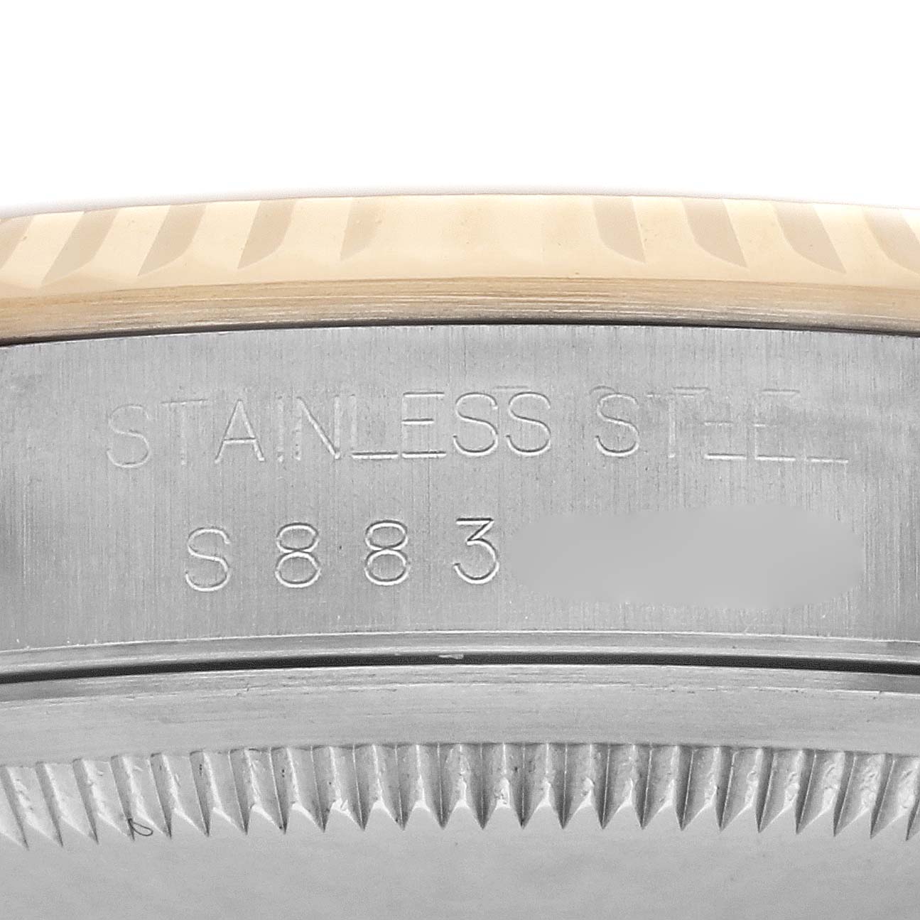 The image shows a close-up of the Rolex Datejust 16233 Men's Steel and Gold (two tone) Champagne Dial 16233 Men's Steel and Gold (two tone) Champagne Dial's side, highlighting the stainless steel case and serial number.