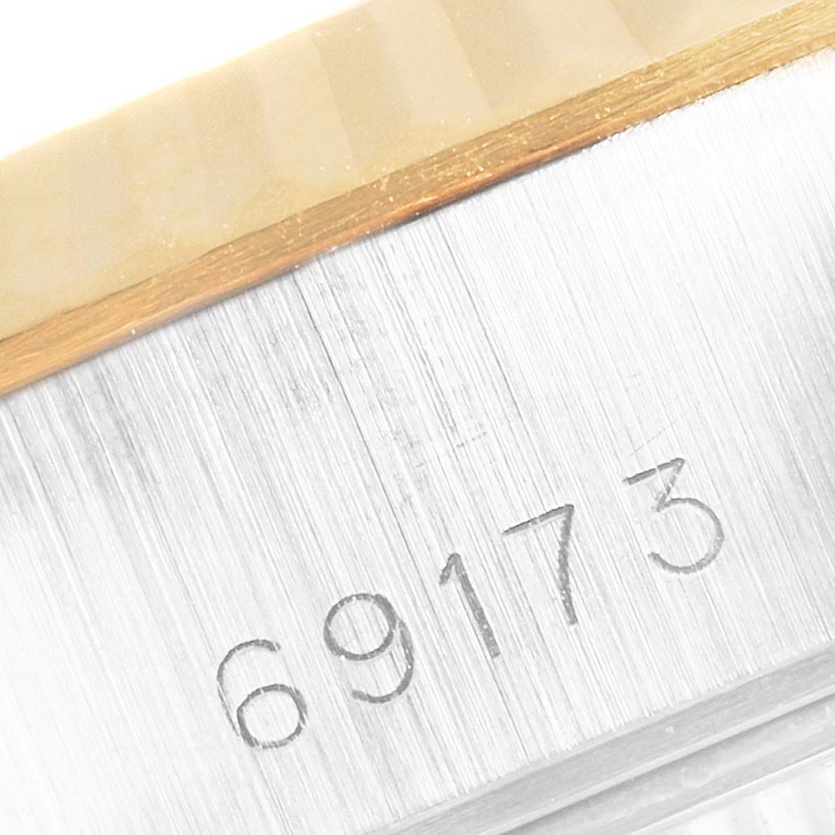 The image shows a close-up of the Rolex Datejust 69173 Women's Steel and Gold (two tone) Mother of Pearl Dial 69173 Women's Steel and Gold (two tone) Mother of Pearl Dial model number "69173" inscribed on the watch case.