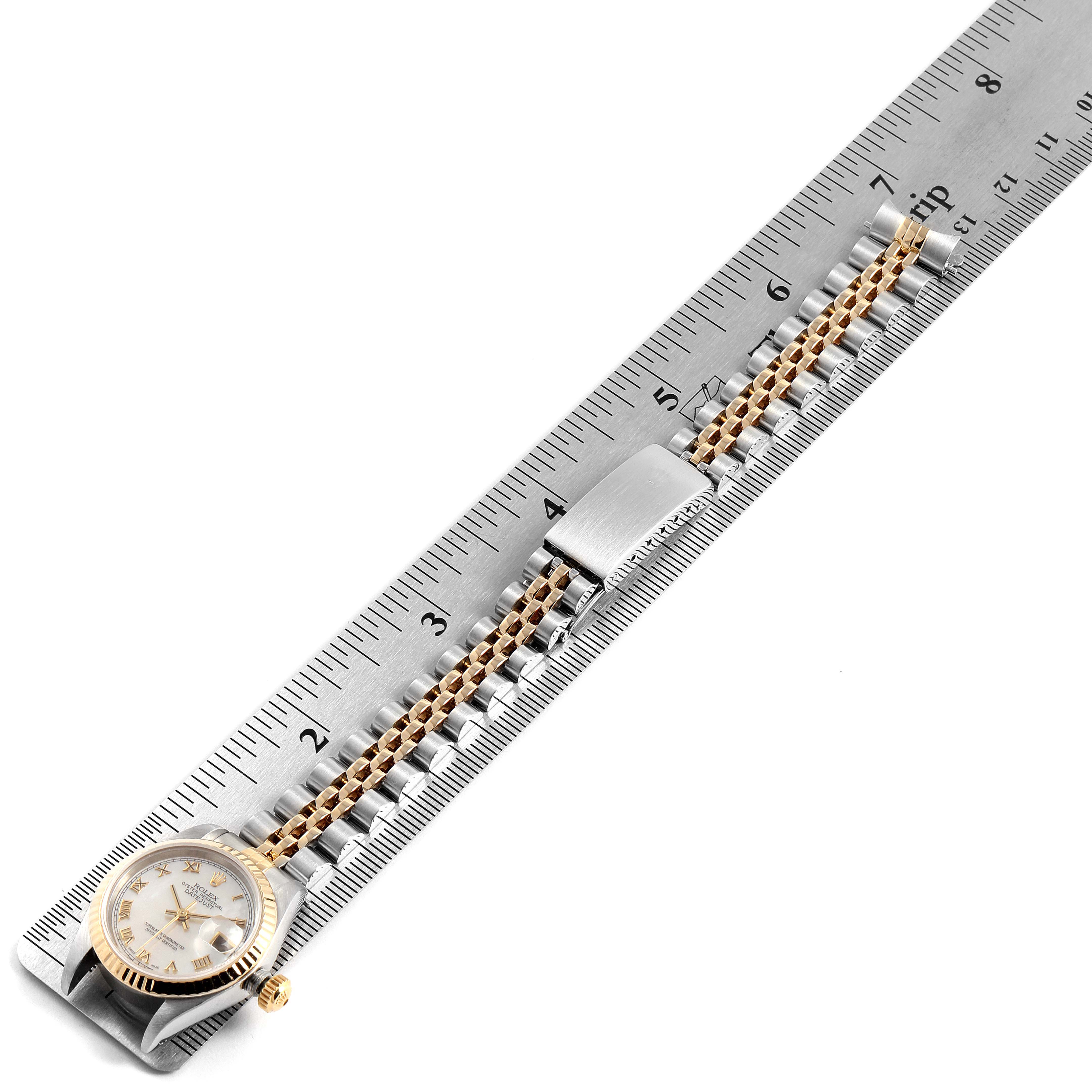 The image shows the Rolex Datejust 69173 Women's Steel and Gold (two tone) Mother of Pearl Dial 69173 Women's Steel and Gold (two tone) Mother of Pearl Dial watch laid flat, with its face and the entire bracelet stretched out along a ruler.