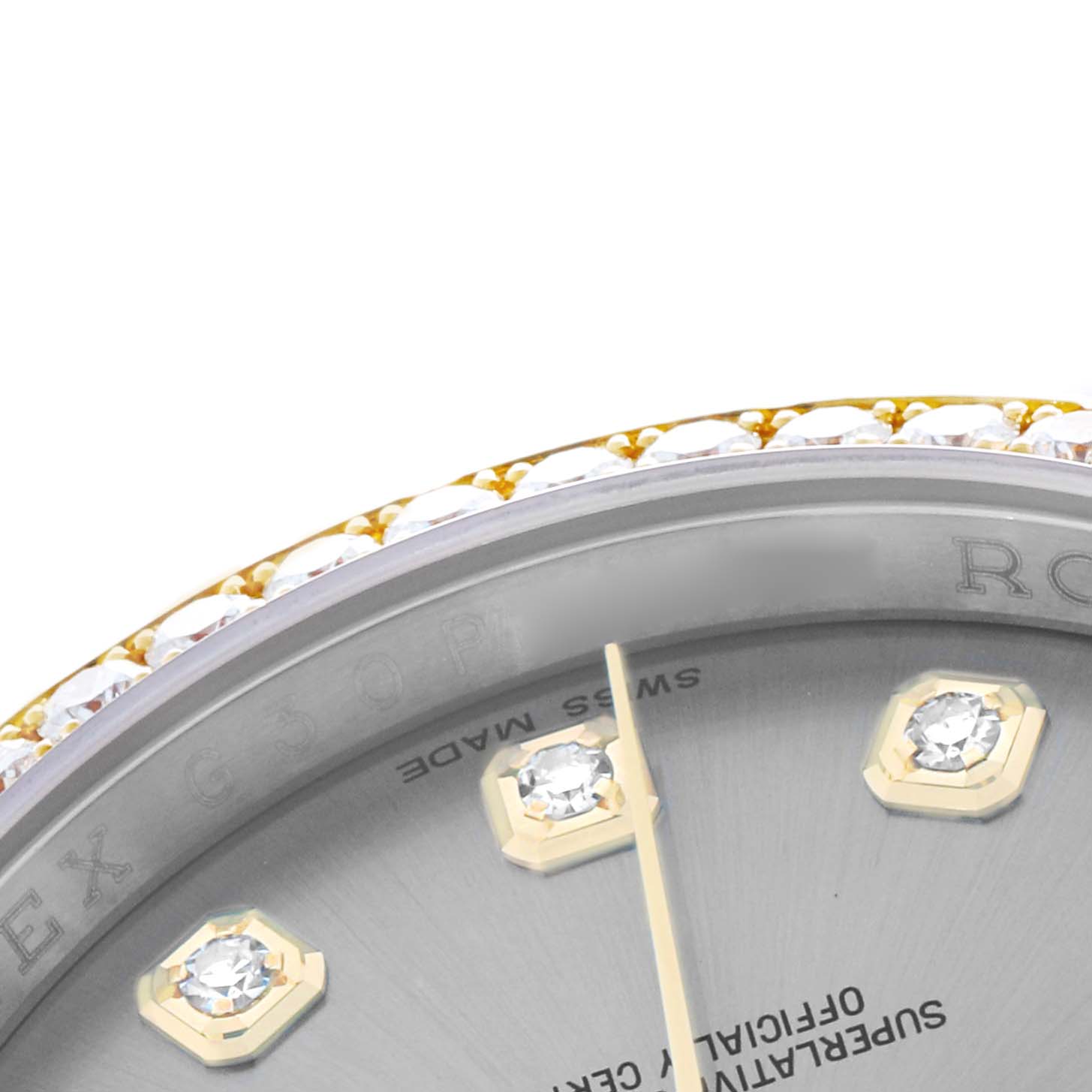 This close-up of the Rolex Datejust 116243 Men
s Steel and Gold (two tone) Silver Dial shows a partial view of the dial, bezel with diamonds, and the second hand.