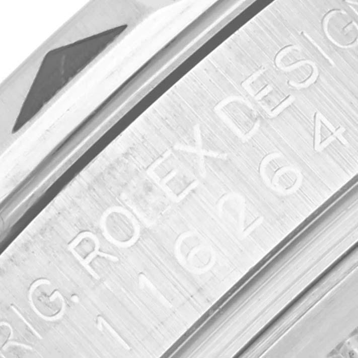 This image shows a close-up angle of the side of a Rolex Turn-o-Graph 116264 Men
s Stainless Steel Blue Dial 116264 Men
s Stainless Steel Blue Dial, focusing on the engraved design.