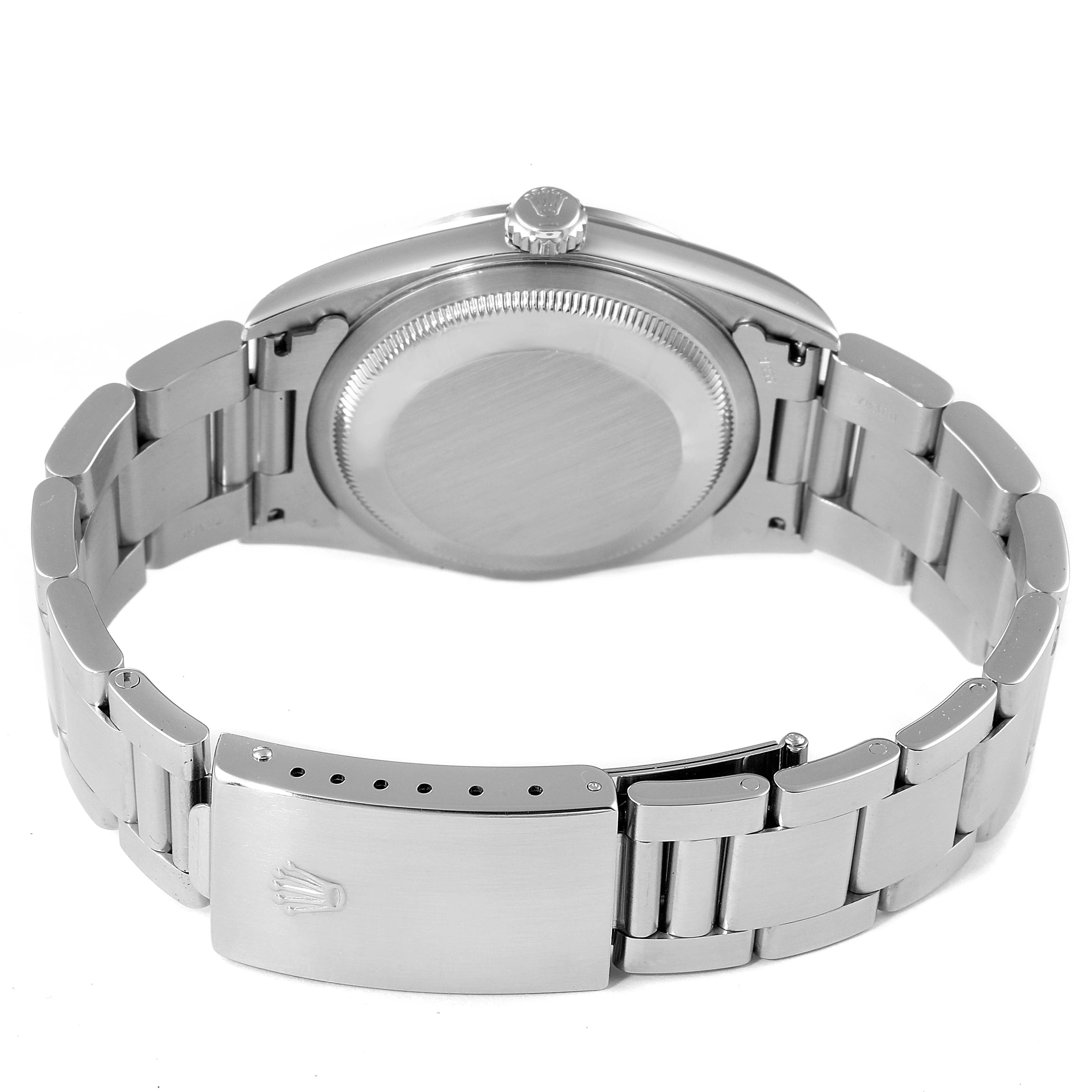 This image shows the back view of a Rolex Datejust 16200 Men's Stainless Steel White Dial 16200 Men's Stainless Steel White Dial watch, focusing on the case, crown, and metal bracelet with the clasp.