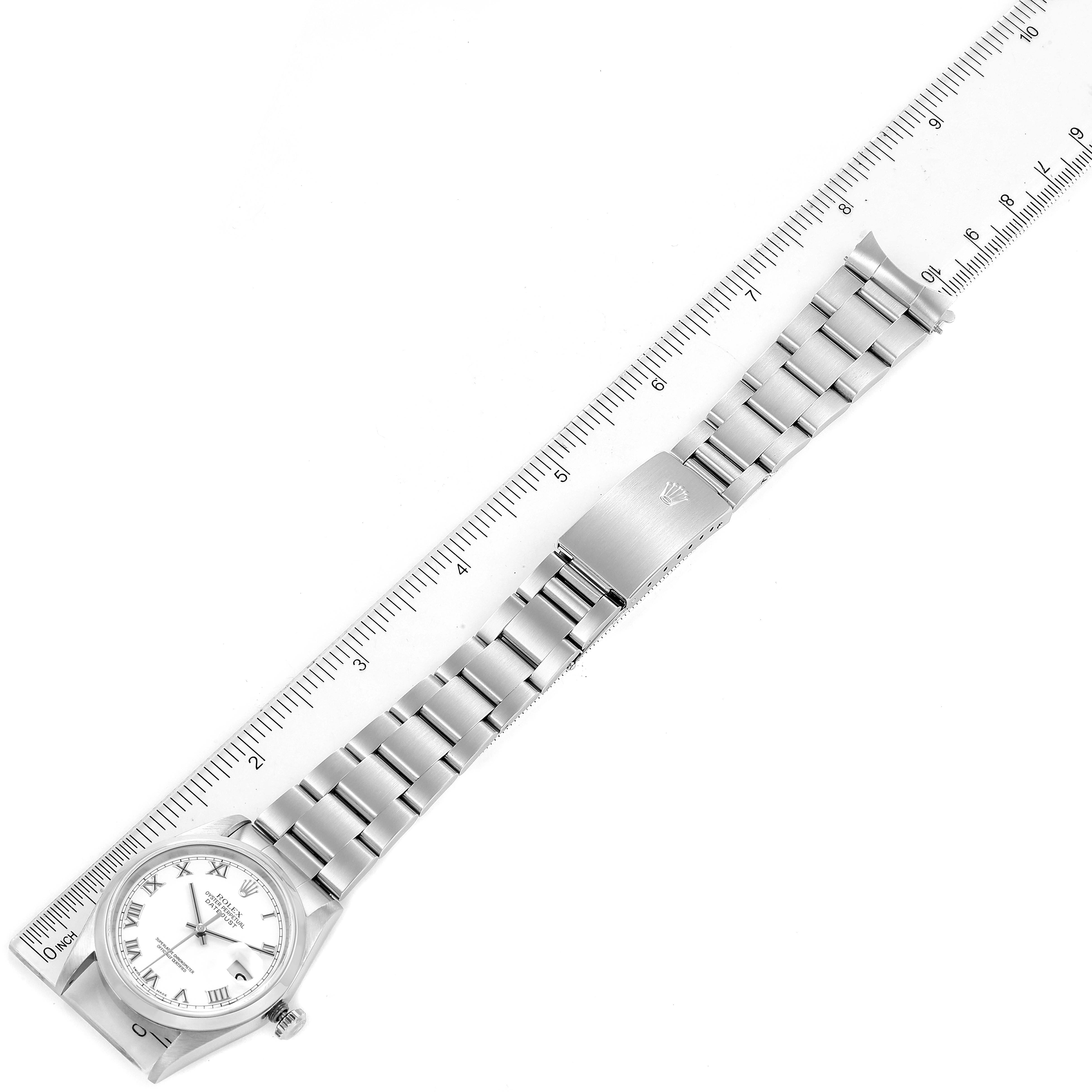 This image shows a Rolex Datejust 16200 Men's Stainless Steel White Dial 16200 Men's Stainless Steel White Dial watch laid flat with the bracelet and dial clearly visible, measured alongside a ruler.