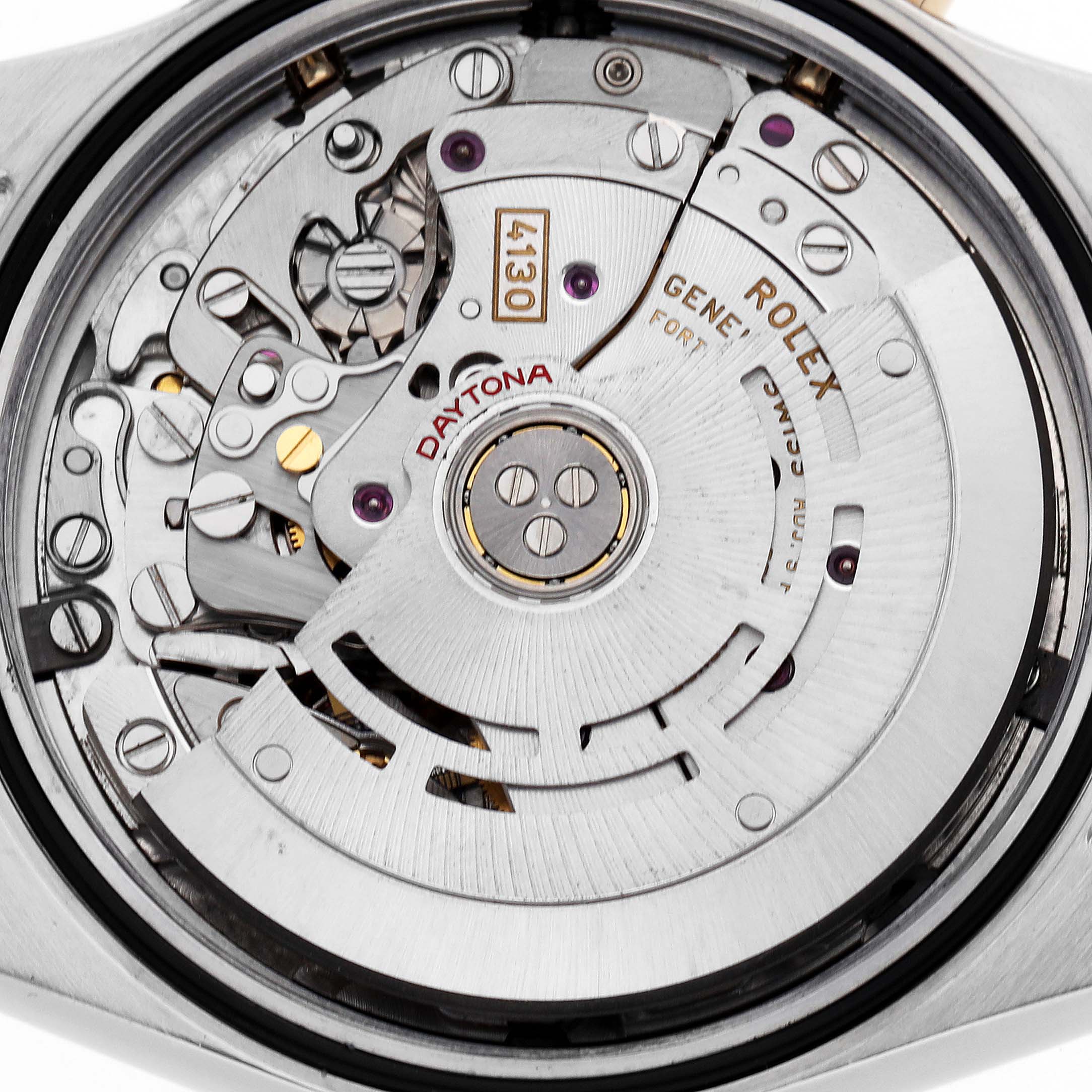 The image shows the movement of a Rolex Daytona 116523 Men
s Steel and Gold (two tone) Black Dial watch from the back, highlighting the intricate mechanical parts.