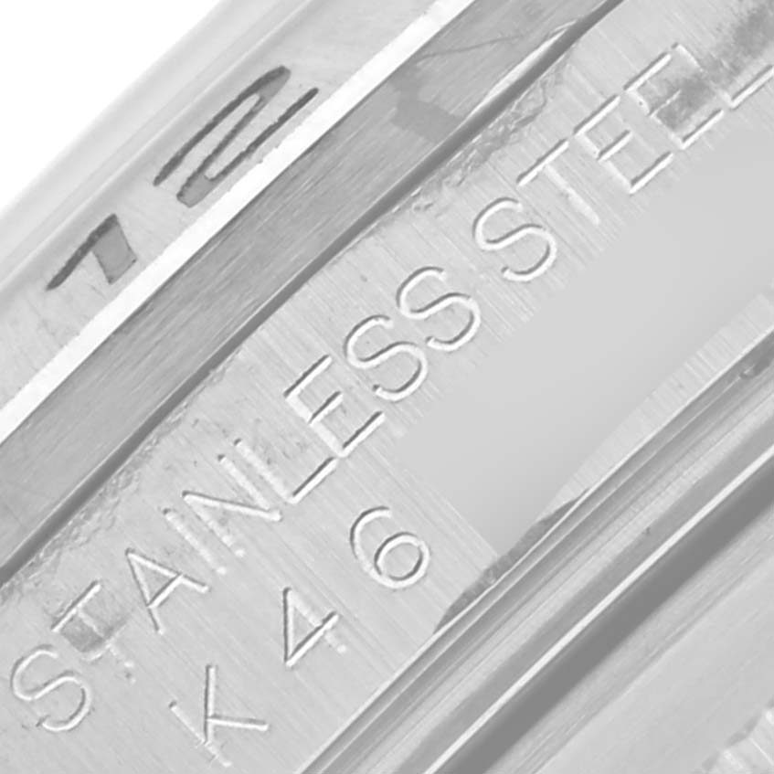 The image shows a close-up angle of the stainless steel band of a Rolex Explorer 16570 Men's Stainless Steel White Dial 16570 Men's Stainless Steel White Dial watch, highlighting its engraved text.