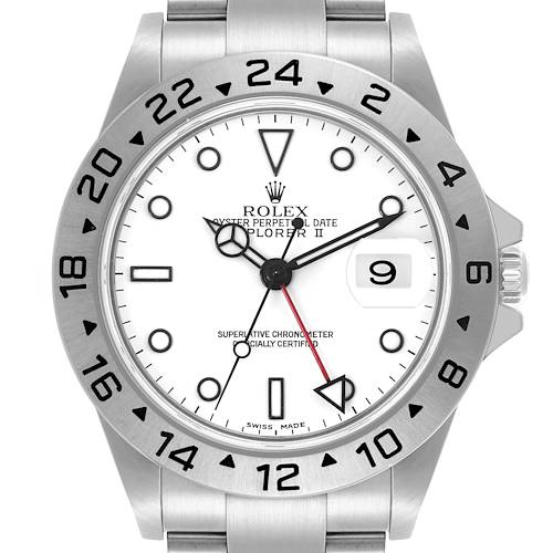 The Rolex Explorer II watch is shown from a front angle, displaying the face, bezel, and part of the bracelet.