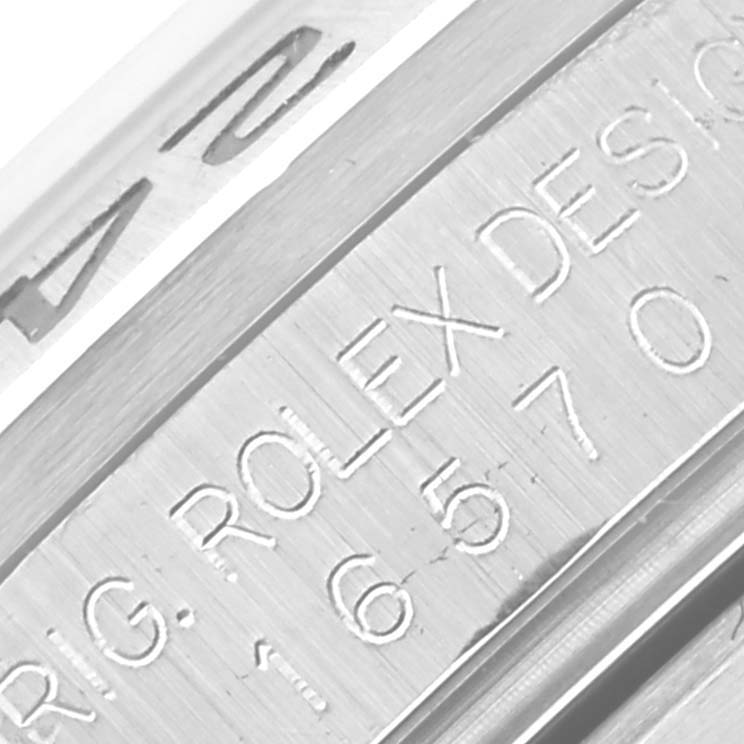 The image shows a close-up of the engraved inner bezel of a Rolex Explorer 16570 Men's Stainless Steel White Dial 16570 Men's Stainless Steel White Dial watch.