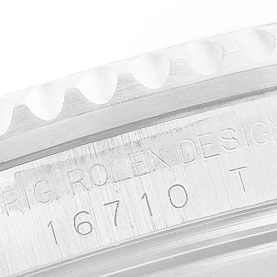 This close-up image shows the side of the bezel and the engraved model number "16710" on the Rolex GMT-Master 16710 Men's Stainless Steel Black Dial 16710 Men's Stainless Steel Black Dial watch.