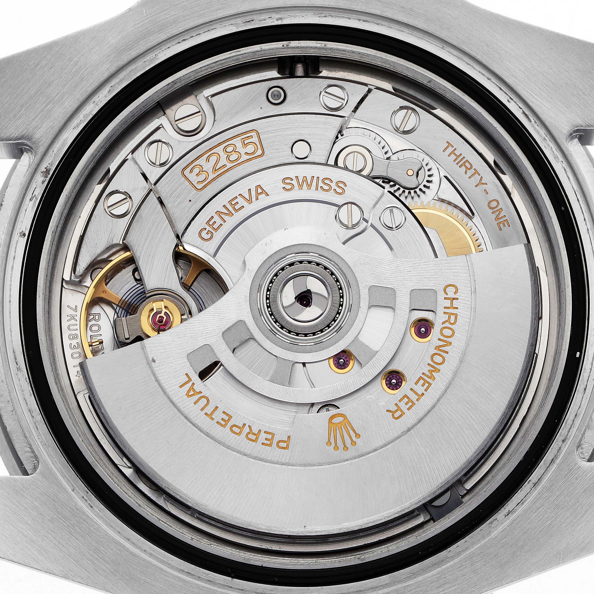 The image shows the back view of a Rolex GMT-Master 126710 Men
s Stainless Steel Black Dial watch, focusing on its 3285 movement and internal components.