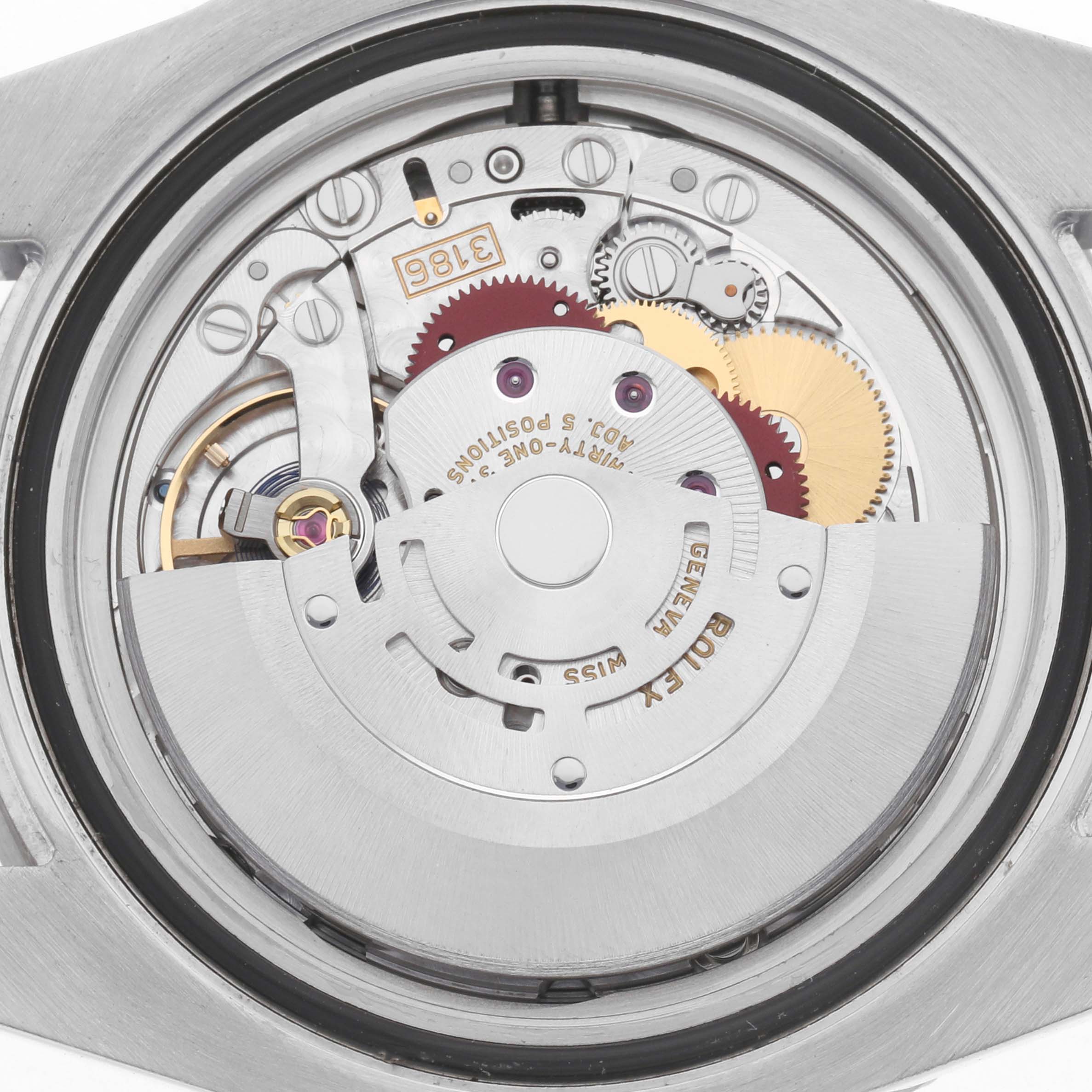 The image shows the movement from the underside of a Rolex GMT-Master 116710BLNR Men's Stainless Steel Black Dial, highlighting gears and components.