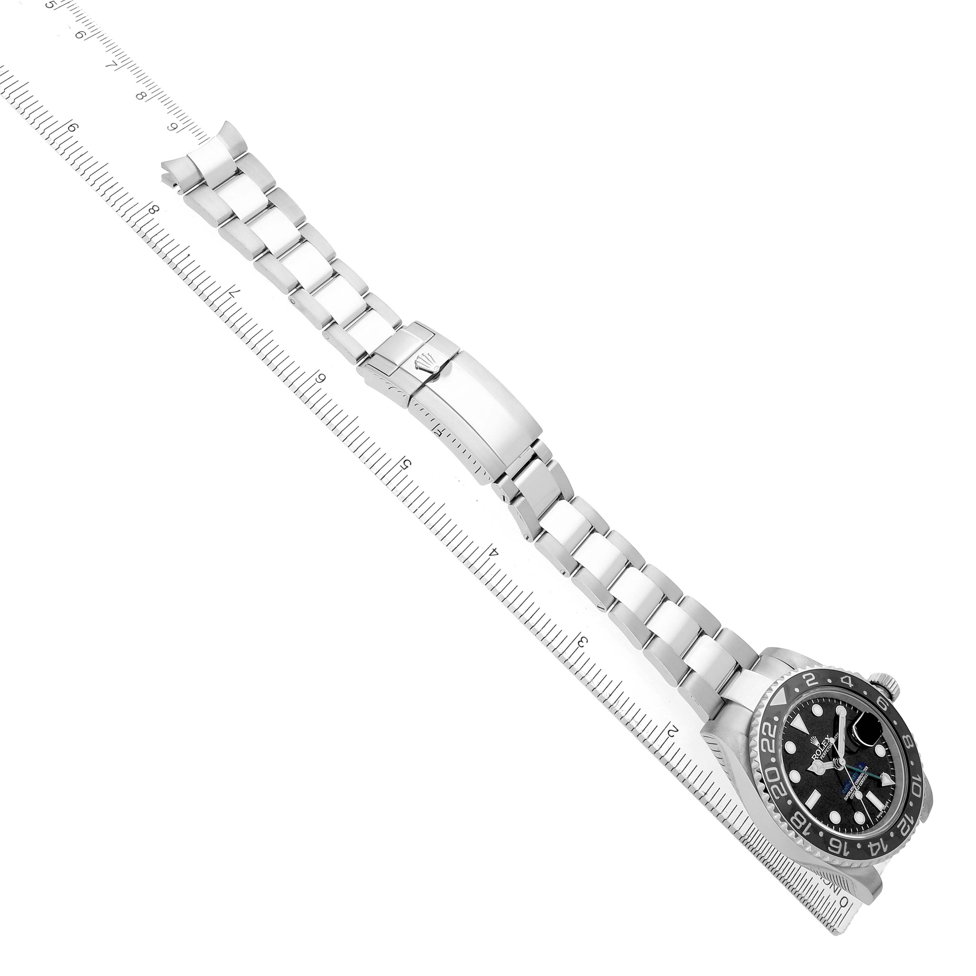 The Rolex GMT-Master 116710 Men
s Stainless Steel Black Dial watch is shown diagonally from an overhead angle, highlighting the bracelet and clasp.