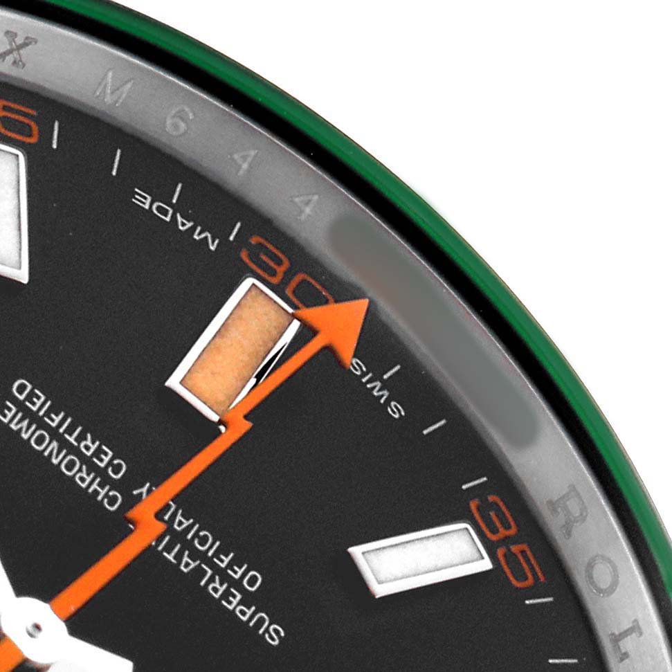 This close-up angle of the Rolex Milgauss 116400GV Men's Stainless Steel Black Dial watch shows part of the dial, including the orange seconds hand and indices.